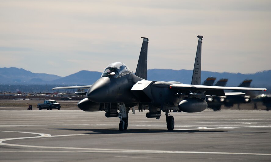 An F-15E Strike Eagle from Seymour Johnson Air Force Base, N.C., taxis on the flightline before takeoff during Red Flag 16-1, Jan. 25 at Nellis Air Force Base, Nev. By gathering a multitude of diverse units together, the exercise facilitates readiness training on a higher level. (U.S. Air Force photo by Senior Airman Alex Fox Echols III/Released) 