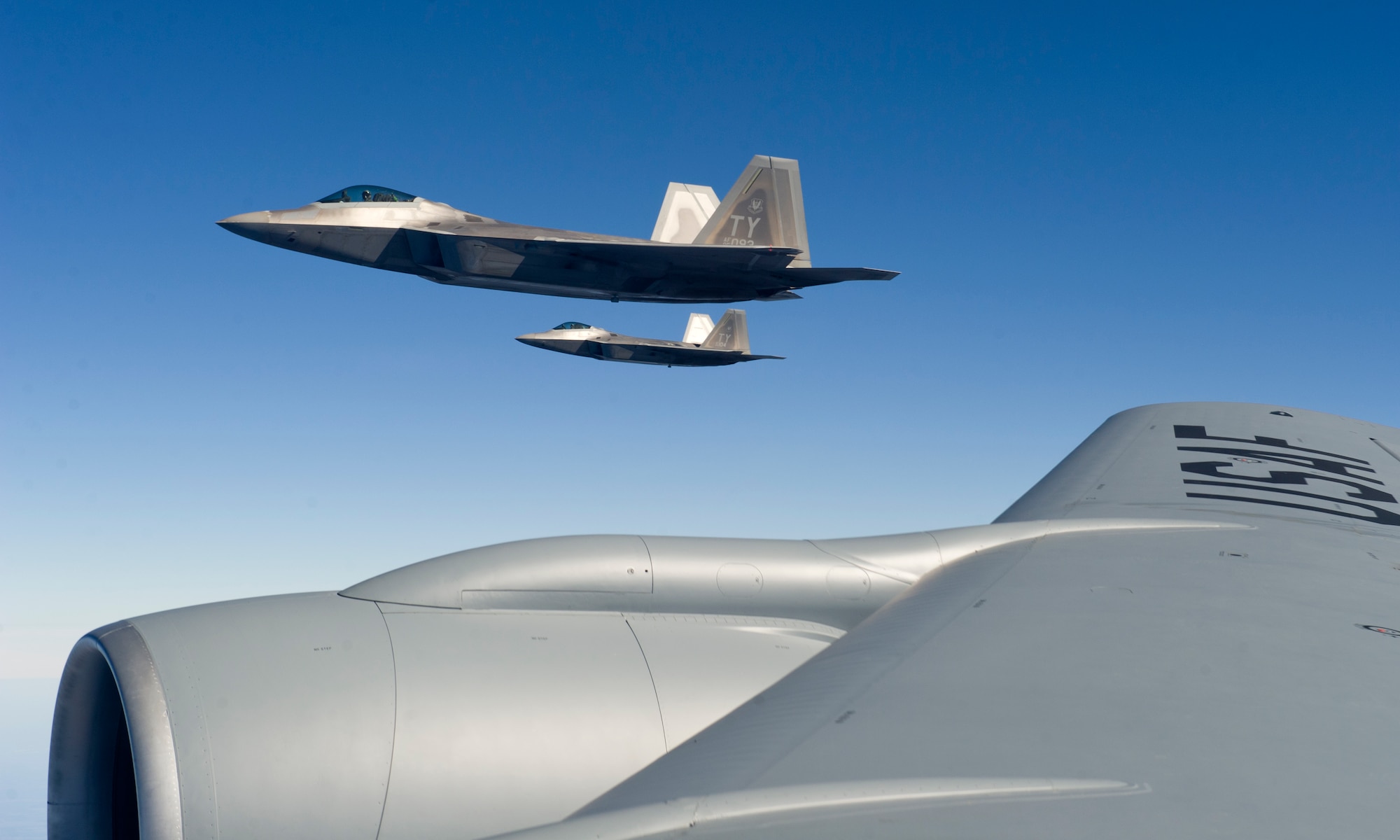 A 95th Fighter Squadron F-22 Raptor is refueled en route to Nellis AFB by a KC-135 Stratotanker from the 126th Air Refueling Wing, Scott AFB, Illinois, Jan. 19. Twelve F-22’s and more than 200 Airmen from Tyndall are participating in Red Flag 16-1. This joint, full-spectrum exercise provides the most realistic combat training available. (U.S. Air Force photo by Senior Airman Alex Fox Echols III/Released)  