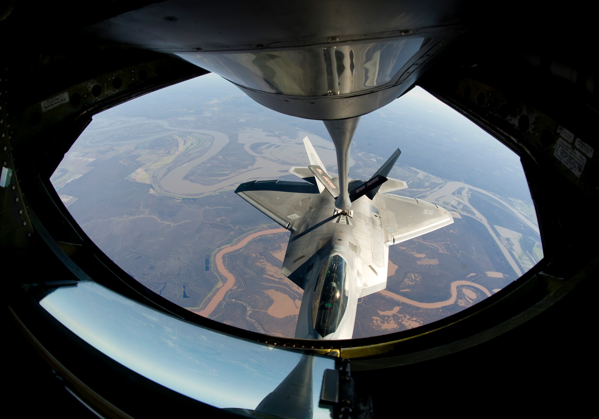 A 95th Fighter Squadron F-22 Raptor is refueled en route to Nellis AFB by a KC-135 Stratotanker from the 126th Air Refueling Wing, Scott AFB, Illinois, Jan. 19. Twelve F-22’s and more than 200 Airmen from Tyndall are participating in Red Flag 16-1. This joint, full-spectrum exercise provides the most realistic combat training available. (U.S. Air Force photo by Senior Airman Alex Fox Echols III/Released)  