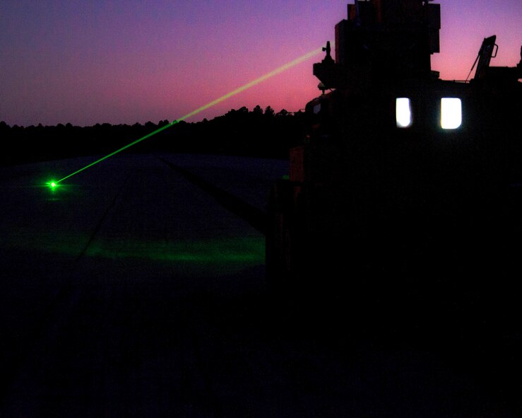 This week’s Squadron of the Week is Tyndall’s Air Force Civil Engineer Center. An airfield explosive ordnance removal vehicle tests its laser during a demonstration at Tyndall’s Silver Flag site, Dec 8.  The vehicle uses a laser to detonate unexploded ordnance on airfields. It is a safer way of disposing hostile bombs when compared to conventional methods.  Developing systems like this is part of the Air Force Civil Engineer Center’s mission. Other mission sets include facility investment planning, design and construction, operations support, real property management, readiness, energy support, environmental compliance and restoration, and audit assertions, acquisition and program management. (U.S. Air Force photo by Senior Airman Solomon Cook/Released)