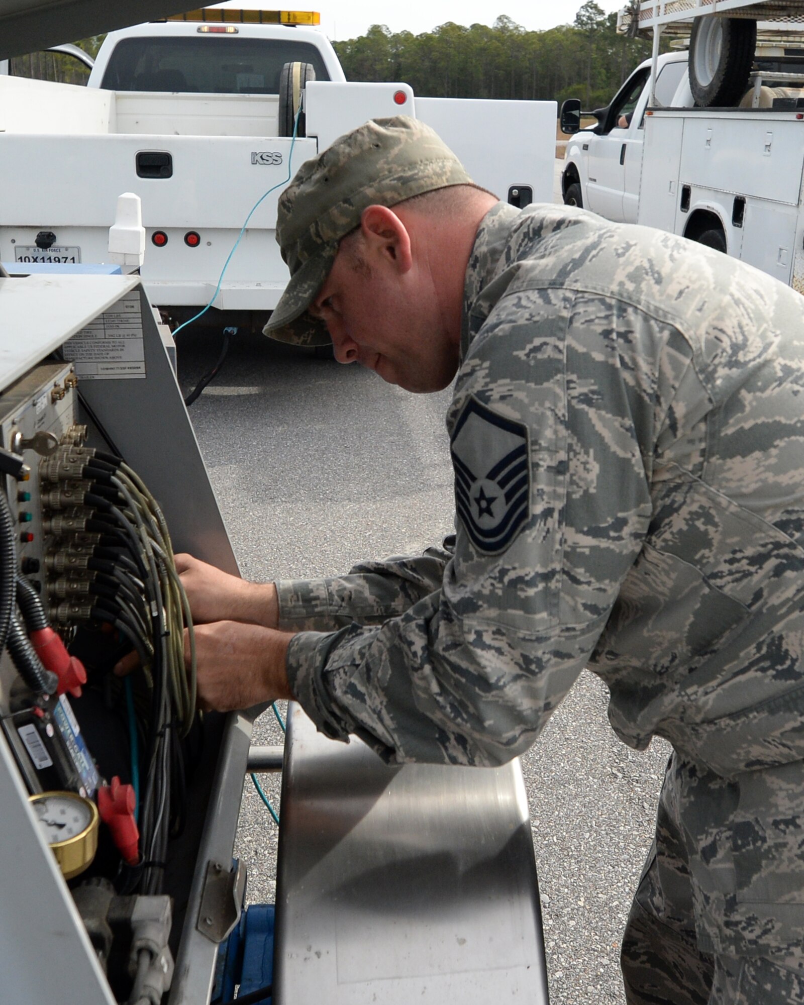 Master Sgt. Bruce King, AFCEC air field pavement evaluation superintendent, conducts maintenance on a heavy-weight deflectometer.  This device is used to measure the quality of the pavements on Air Force runways and ensures the safety of any aircraft that land on them.  (U.S. Air Force photo by Airman 1st Class Cody R. Miller/Released)