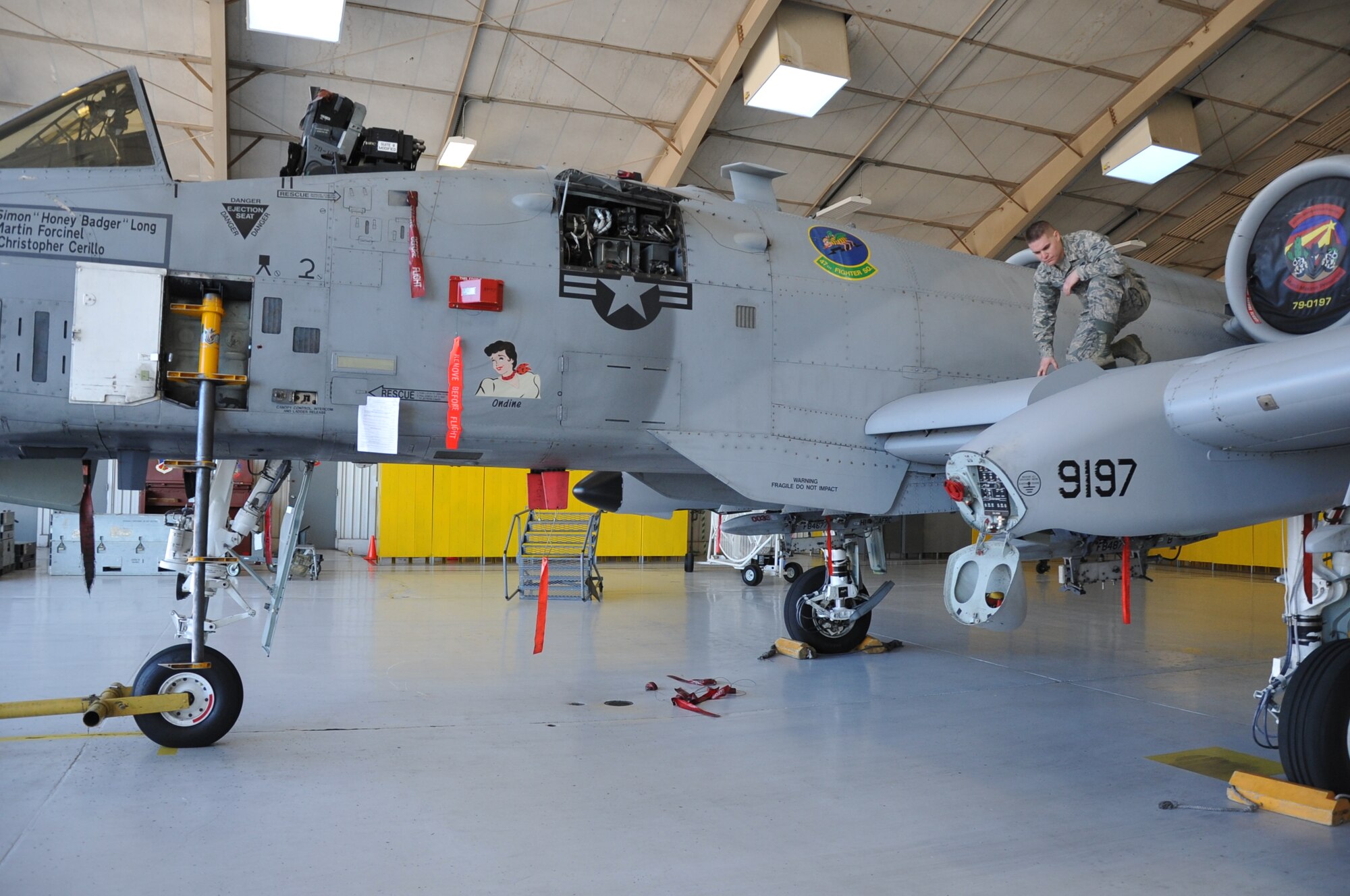 Airman 1st Class Michael Rosenberger, a 924th Maintenance Squadron crew chief, inspects an A-10 Warthog in the hangar at Davis-Monthan Air Force Base, Ariz., Jan. 14. The A-10s here fall under the 924th Fighter Group which is part of the Air Force Reserve Command's 944th Fighter Wing, Luke Air Force Base, Ariz. It is a Total Force Enterprise Classic Associate to the 355th Fighter Wing, conducting A-10C Thunderbolt II qualification
training and maintenance operations. There are 28 aircraft and about 450 personnel assigned to the maintenance squadron, including traditional and full-time reservists. Rosenberger is one of the newest maintainers in the squadron, having enlisted early in 2015. The A-10 Thunderbolt II has excellent maneuverability at low air speeds and altitude, and is a highly accurate and survivable weapons-delivery platform. The aircraft can loiter near battle areas for extended periods of time and operate in low ceiling and visibility conditions. The wide combat radius and short takeoff and landing capability permit operations in and out of locations near front lines. Using night vision goggles, A-10 pilots can conduct their missions during darkness. Because of the specialty maintenance skills the Air Force Reserve afforded Rosenberger by sending him through maintenance technical training, he's been hired locally to work on German-made vehicles at Mini of
Tucson. The first production A-10A was delivered to Davis-Monthan AFB in October 1975, and the 924th Fighter Group was assigned to Davis-Monthan AFB in 2011. (U.S. Air Force photo/Carolyn Herrick) 