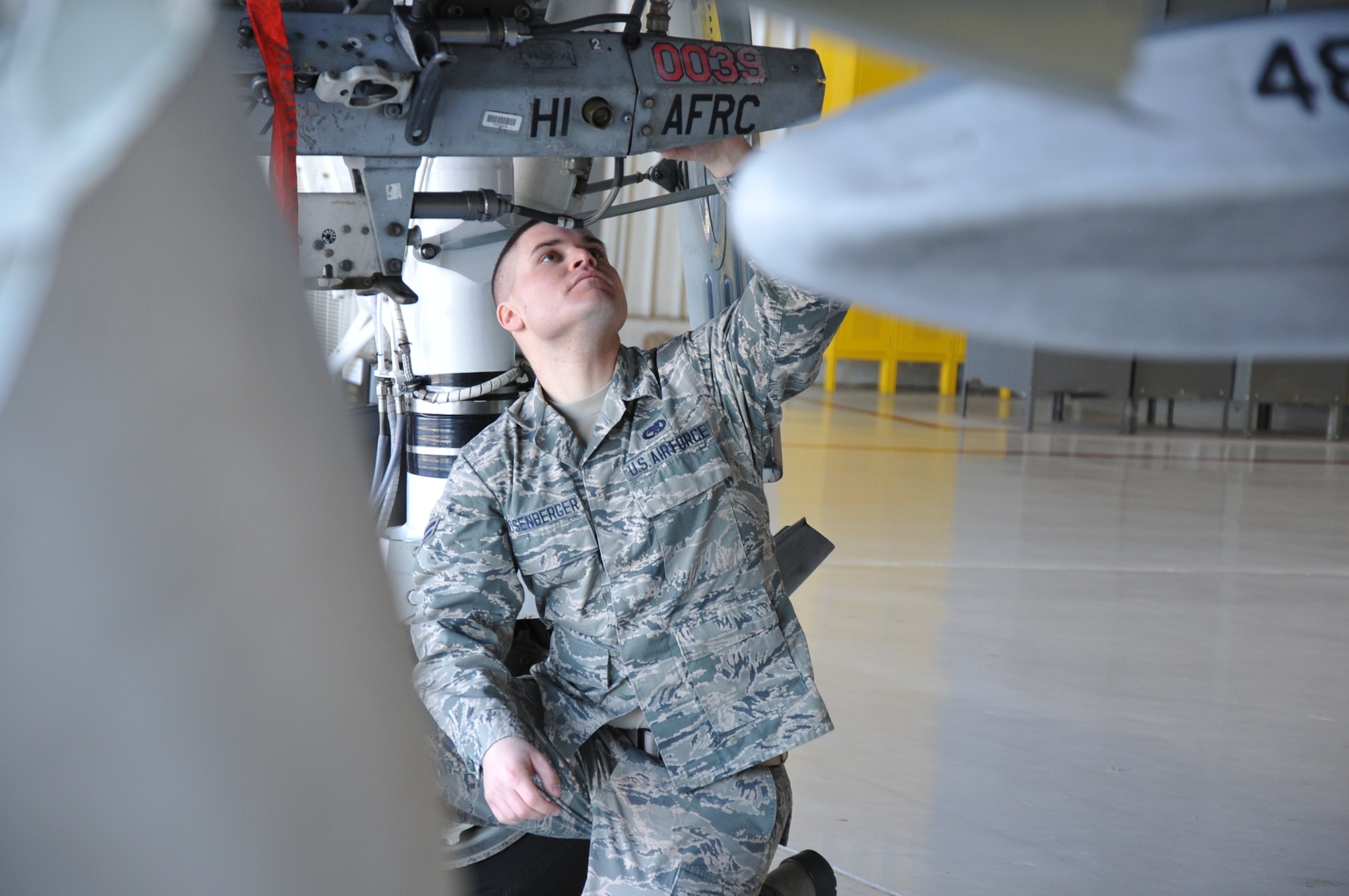 Airman 1st Class Michael Rosenberger, a 924th Maintenance Squadron crew chief, inspects an A-10 Warthog in the hangar at Davis-Monthan Air Force Base, Ariz., Jan. 14. The A-10s here fall under the 924th Fighter Group which is part of the Air Force Reserve Command's 944th Fighter Wing, Luke Air Force Base, Ariz. It is a Total Force Enterprise Classic Associate to the 355th Fighter Wing, conducting A-10C Thunderbolt II qualification
training and maintenance operations. There are 28 aircraft and about 450 personnel assigned to the maintenance squadron, including traditional and full-time reservists. Rosenberger is one of the newest maintainers in the squadron, having enlisted early in 2015. The A-10 Thunderbolt II has excellent maneuverability at low air speeds and altitude, and is a highly accurate and survivable weapons-delivery platform. The aircraft can loiter near battle areas for extended periods of time and operate in low ceiling and visibility conditions. The wide combat radius and short takeoff and landing capability permit operations in and out of locations near front lines. Using night vision goggles, A-10 pilots can conduct their missions during darkness. Because of the specialty maintenance skills the Air Force Reserve afforded Rosenberger by sending him through maintenance technical training, he's been hired locally to work on German-made vehicles at Mini of
Tucson. The first production A-10A was delivered to Davis-Monthan AFB in October 1975, and the 924th Fighter Group was assigned to Davis-Monthan AFB in 2011. (U.S. Air Force photo/Carolyn Herrick) 