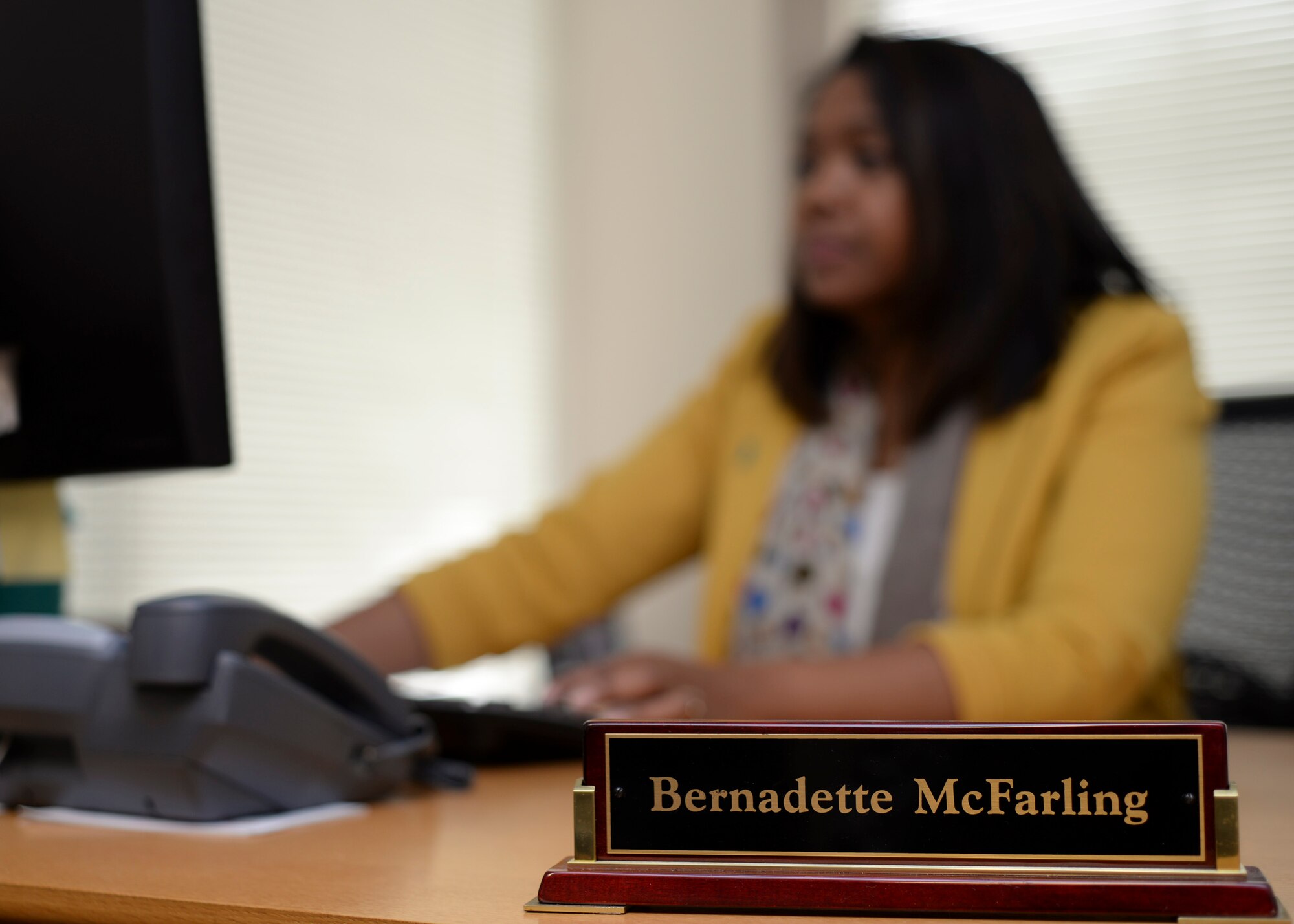 Eunice “Bernie” McFarling, 28th Bomb Wing sexual assault response coordinator, settles in as the new SARC at Ellsworth Air Force Base, S.D., Jan. 15, 2015. As the base’s SARC, McFarling is the central contact for those who have been victims of sexual assault. (U.S. Air Force photo by Senior Airman Anania Tekurio/Released)