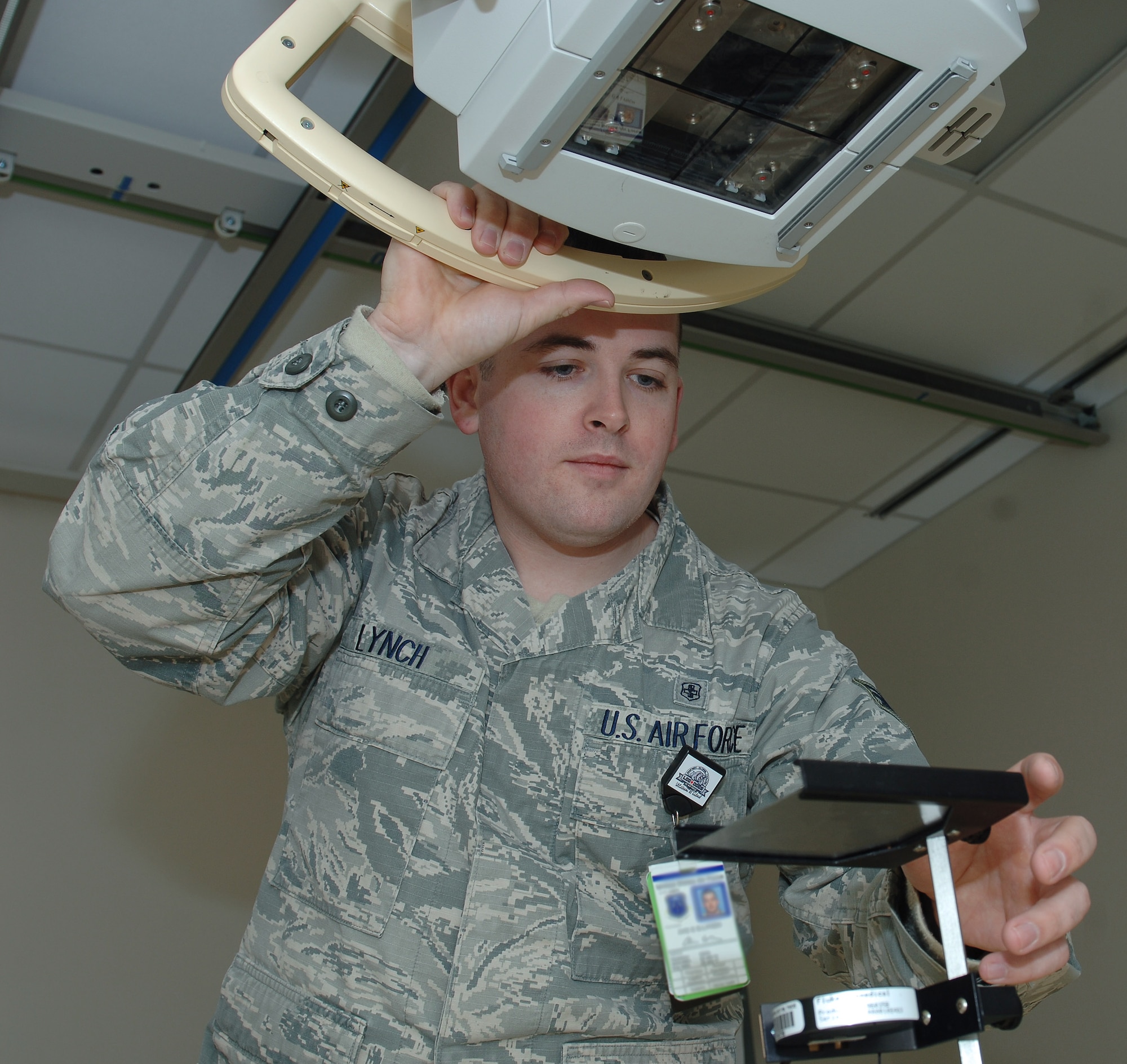 U.S. Air Force Senior Airman Christopher Lynch, 633rd Medical Support Squadron biomedical equipment technician, sets up test equipment to calibrate an x-ray machine at Langley Air Force Base, Va., Jan. 13, 2016. BMETs are responsible for ensuring an estimated 5,300 pieces of medical equipment are in working condition to help serve patients' medical needs. (U.S. Air Force photo by Staff Sgt. Teresa J. Cleveland)