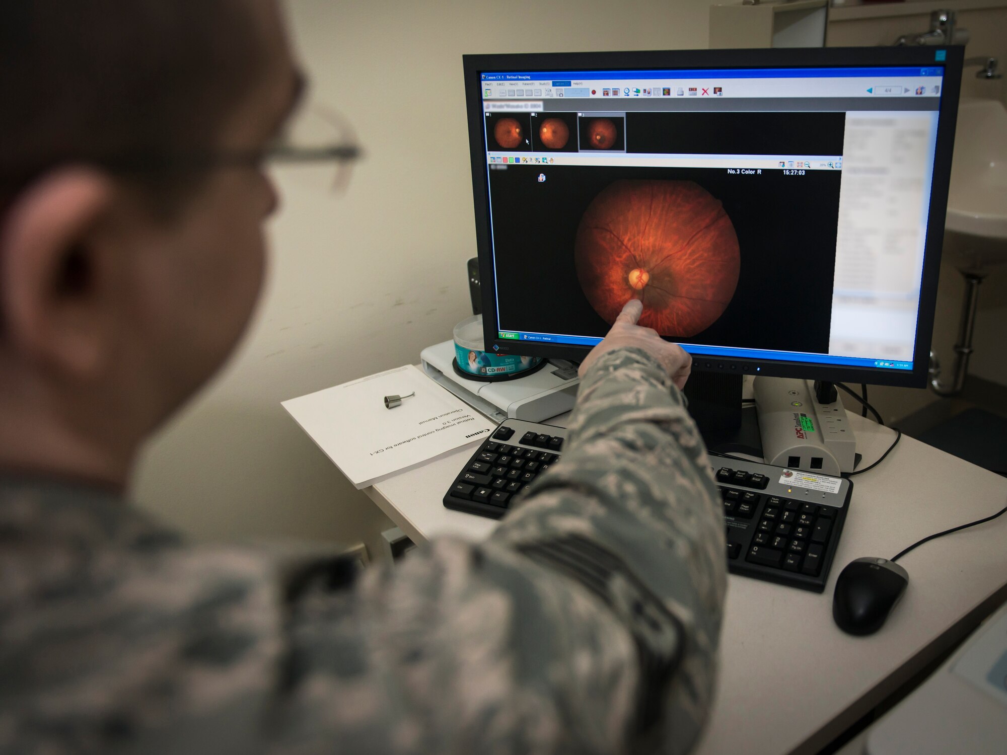 U.S. Air Force Staff Sgt. Christopher Hutchinson, an optometry technician with the 35th Aerospace Medicine Squadron, examines a patient’s retinal scan at Misawa Air Base, Japan, Jan. 21, 2016. “If you can’t see them, you can’t shoot them,” Hutchinson said as he explained the optometry flight’s importance in a service member’s life. In the same way they support the war fighters on the ground down range, they’re also the primary factor in a pilot’s medical clearance to fly. “Without us, they’re literally flying blind,” he said. “People just can’t see without us.” Hutchinson is a Cincinnati, Ohio, native. (U.S. Air Force photo by Staff Sgt. Benjamin W. Stratton)