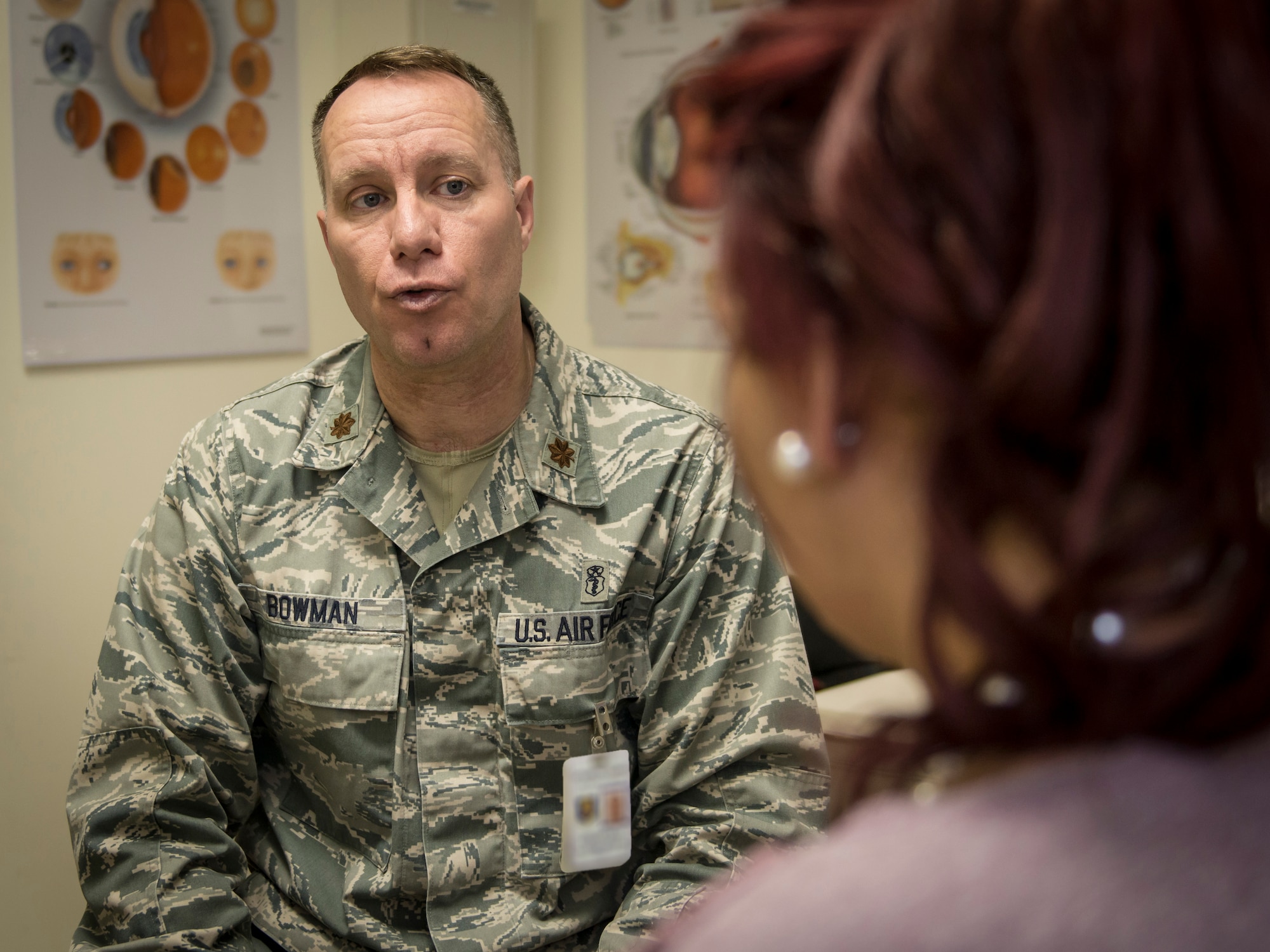 U.S. Air Force Maj. Ronny Bowman, an optometric physician with the 35th Aerospace Medicine Squadron, discusses with Tina Rueb, a child youth program assistant with the Lunney Youth Center, the health and wellness of her eyes at Misawa Air Base, Japan, Jan. 21, 2016. Routine eye exams offer patients a prescription for glasses if they need them and is more than a simple vision screening test typically conducted by their primary care doctor. A prescription for contact lenses requires a separate exam. Optometry also provides optional well-child eye exams every two years between the ages of three and six and also include a screening for lazy eye and crossed eyes. These exams are provided by an optometrist or ophthalmologist. Bowman hails from Paris, Arkansas, and Reub is a Clovis, New Mexico, native. (U.S. Air Force photo by Staff Sgt. Benjamin W. Stratton)