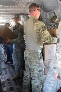 U.S. Army members with Joint Task Force-Bravo unload supplies from a CH-47 Chinook during a medical training exercise Jan. 27, 2016 in Gracias a Dios Department (state), Honduras. The Task Force supported the Honduran medical effort, helping provide the rural population with basic medical care and supplies. (U.S. Army photo by Maria Pinel/ Released)