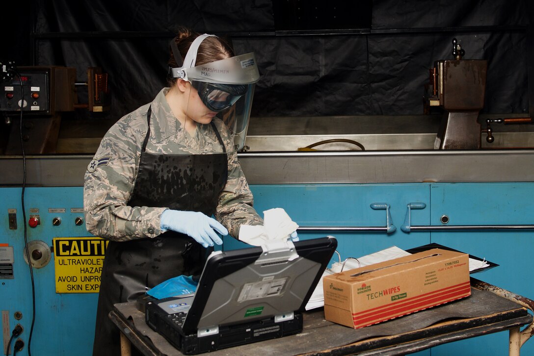U.S. Air Force Airman 1st Class Emily Anderson, 1st Maintenance Squadron nondestructive journeyman, prepares for a magnetic particle inspection at Langley Air Force Base, Va., Jan. 25, 2016. The test was performed to check system effectiveness, ensuring all equipment worked properly. (U.S. Air Force photo by Airman 1st Class Derek Seifert)