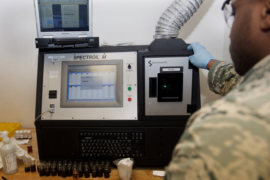 U.S. Air Force Staff Sgt. Courtney Finklin, 1st Maintenance Squadron nondestructive inspection craftsman, conducts an oil analysis at Langley Air Force Base, Va., Jan. 25, 2016. Oil analysis test are preventative maintenance for finding specific metal wear in an engine. (U.S. Air Force photo by Airman 1st Class Derek Seifert)