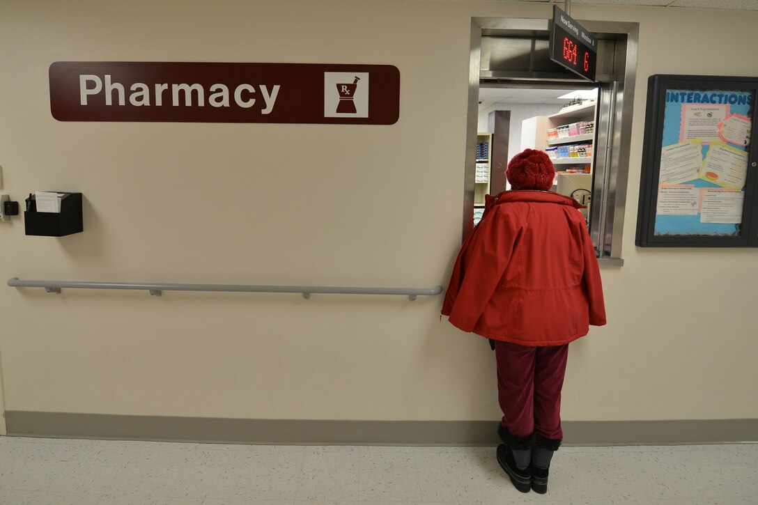 A McDonald Army Health Care first-floor pharmacy customer picks up medication at Fort Eustis, Va., Jan. 26, 2016. The first floor pharmacy is the largest of the health center’s six pharmacies and it specializes in providing out-patient prescriptions. (U.S. Air Force photo by Staff Sgt. Stannard)