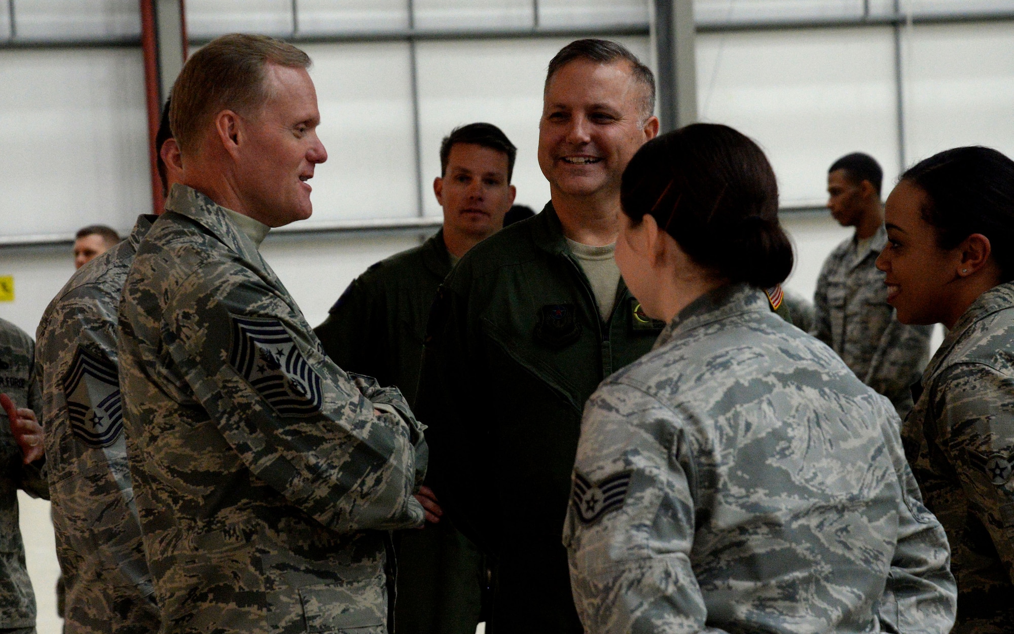 Chief Master Sgt. of the Air Force James Cody dedicates time to socialize with Airmen during his visit Jan. 27, 2016, on RAF Mildenhall, England. He visited various units to learn about the duties of Airmen around the base and express his gratitude for their hard work and dedication to the mission. (U.S. Air Force photo by Airman 1st Class Justine Rho/Released)