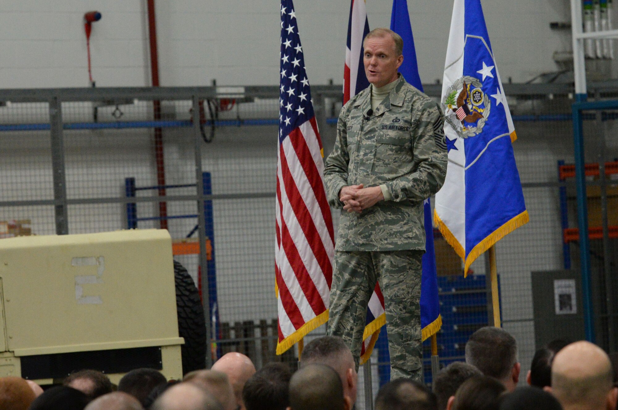Chief Master Sgt. of the Air Force James Cody speaks to Airmen during an all call Jan. 27, 2016, on RAF Mildenhall, England. Cody addressed the importance of interpersonal relationships and the importance of each Airman’s contribution to the mission. (U.S. Air Force photo by Airman 1st Class Justine Rho/Released)