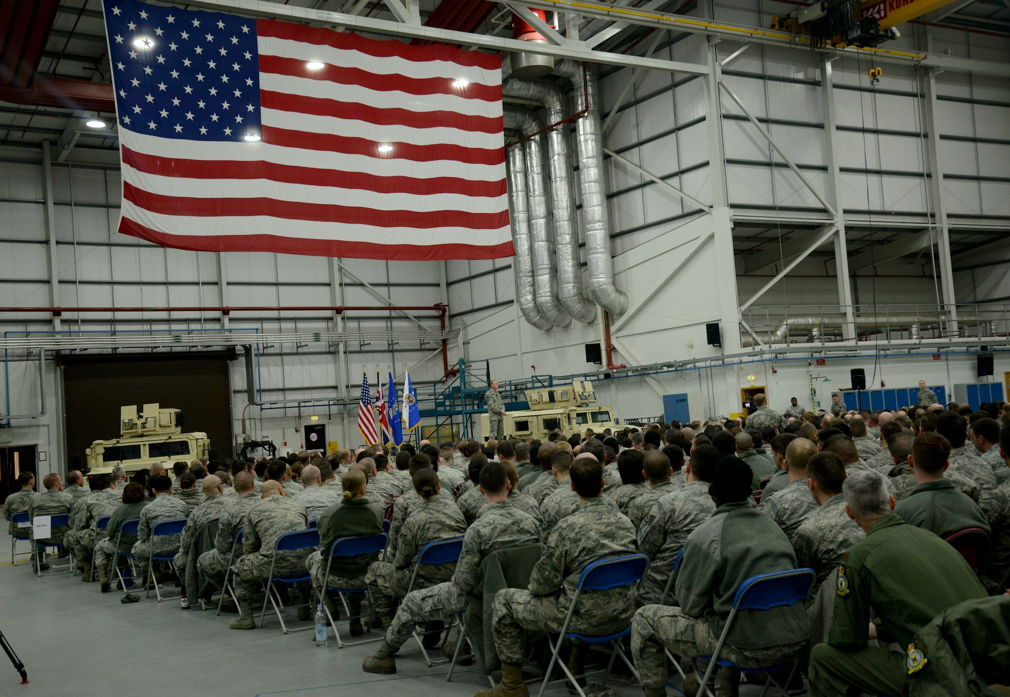 Team Mildenhall Airmen gather to listen to Chief Master Sgt. of the Air Force James Cody speak Jan. 27, 2016, during an all call at RAF Mildenhall, England. Cody addressed the importance of interpersonal relationships and the importance of each Airman’s contribution to the mission. (U.S. Air Force photo by Airman 1st Class Justine Rho/Released)