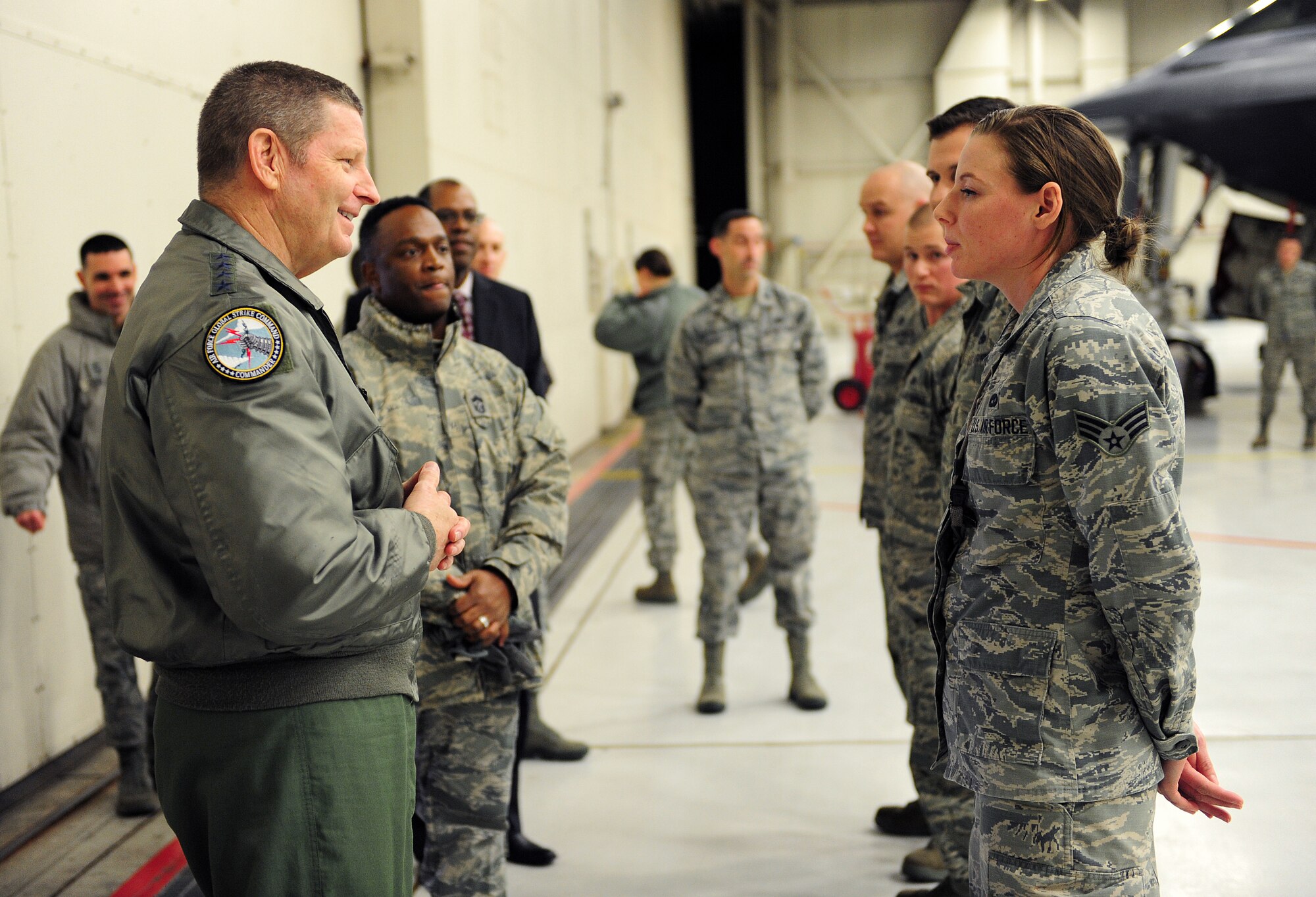 Gen. Robin Rand, AFGSC commander, speaks with Senior Airman Rebecca Krause, an aircraft armament journeyman assigned to the 131st Aircraft Maintenance Squadron, prior to receiving a coin for her superior performance. Krause filled a one-year temporary technician position as a weapons loader, working full-time alongside active-duty counterparts, where she trained 10 active duty and Guard members. Her continuity of training is an important factor to the armament shop’s 98 percent pass rate. (U.S. Air Force photo by Airman 1st Class Jazmin Smith)