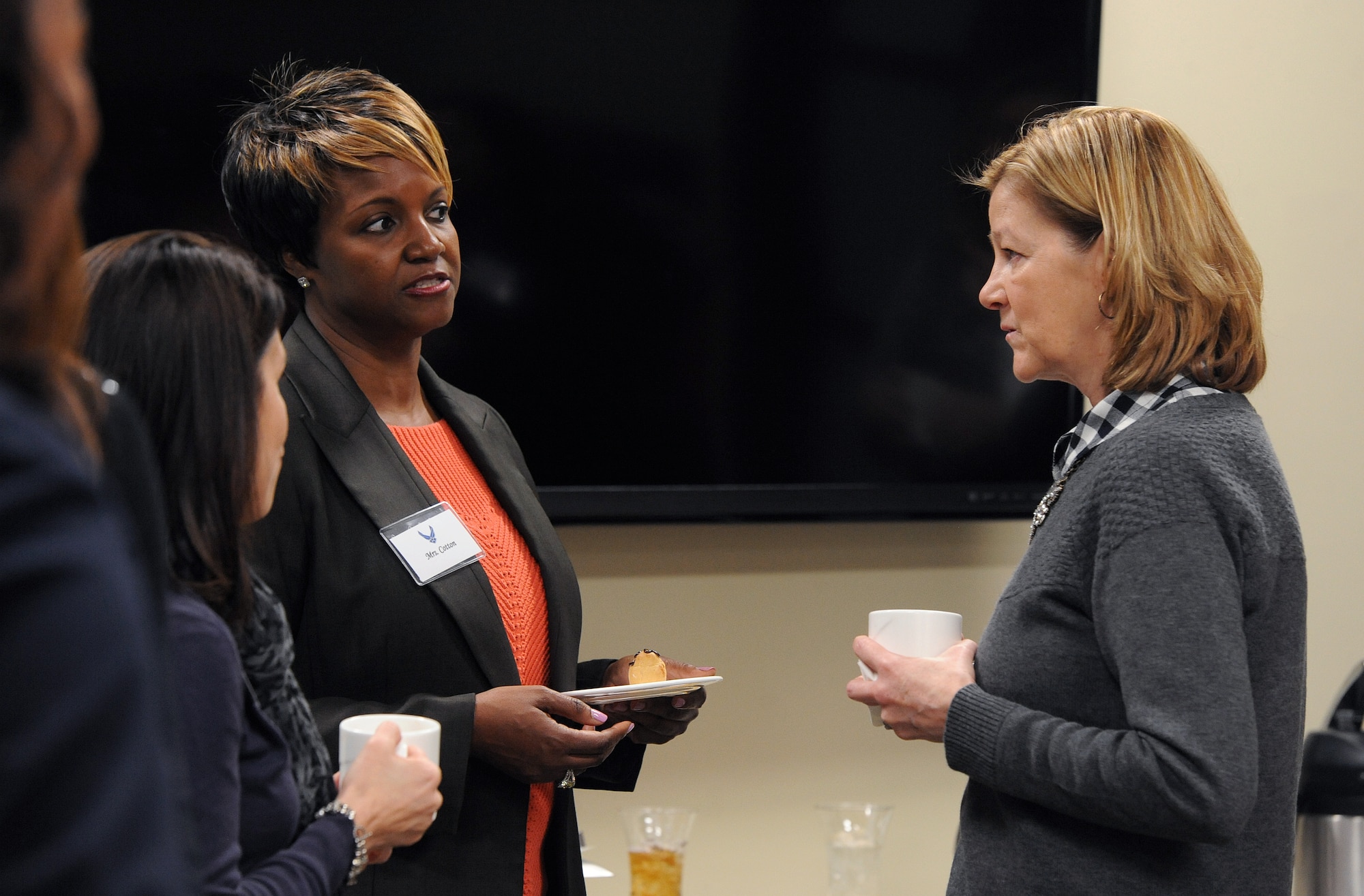 Kim Rand, right, wife of AFGSC commander Gen. Robin Rand, talks with Patricia Cotton, left, a 509th Force Support Squadron community readiness technician, during a coffee social with key spouses at Whiteman Air Force Base, Mo., Jan. 20, 2016. The Key Spouse program is an Airman and Family Readiness Center program offering support and mentoring on resources available while service members are deployed. (U.S. Air Force photo by Airman 1st Class Jazmin Smith)