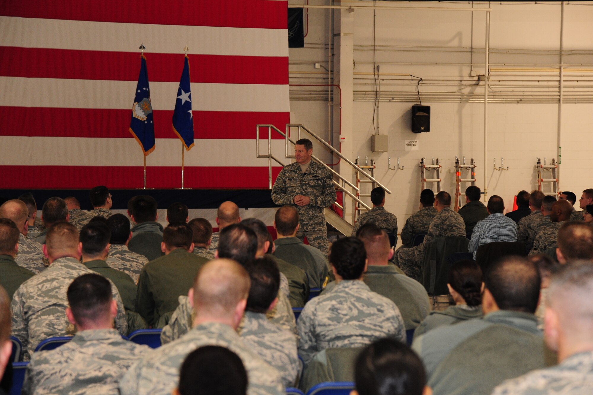 Gen. Robin Rand, AFGSC commander, speaks to Airmen during an all call gathering at Whiteman Air Force Base, Mo., Jan. 20, 2016. Rand talked about heritage, being a good wingman and families, expressing the importance of all three and how they to apply to the Air Force mission. (U.S. Air Force photo by Senior Airman Keenan Berry)