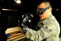 Senior Airman Max Bustamante, 22nd Maintenance Squadron non-destructive inspection Airman, cleans the chemicals off a section of KC-135 Stratotanker landing gear, Jan. 25, 2016, at McConnell Air Force Base, Kan. NDI Airmen perform preventative maintenance on numerous aircraft parts to ensure there is no damage to the equipment. (U.S. Air Force photo/Airman Jenna K. Caldwell)  