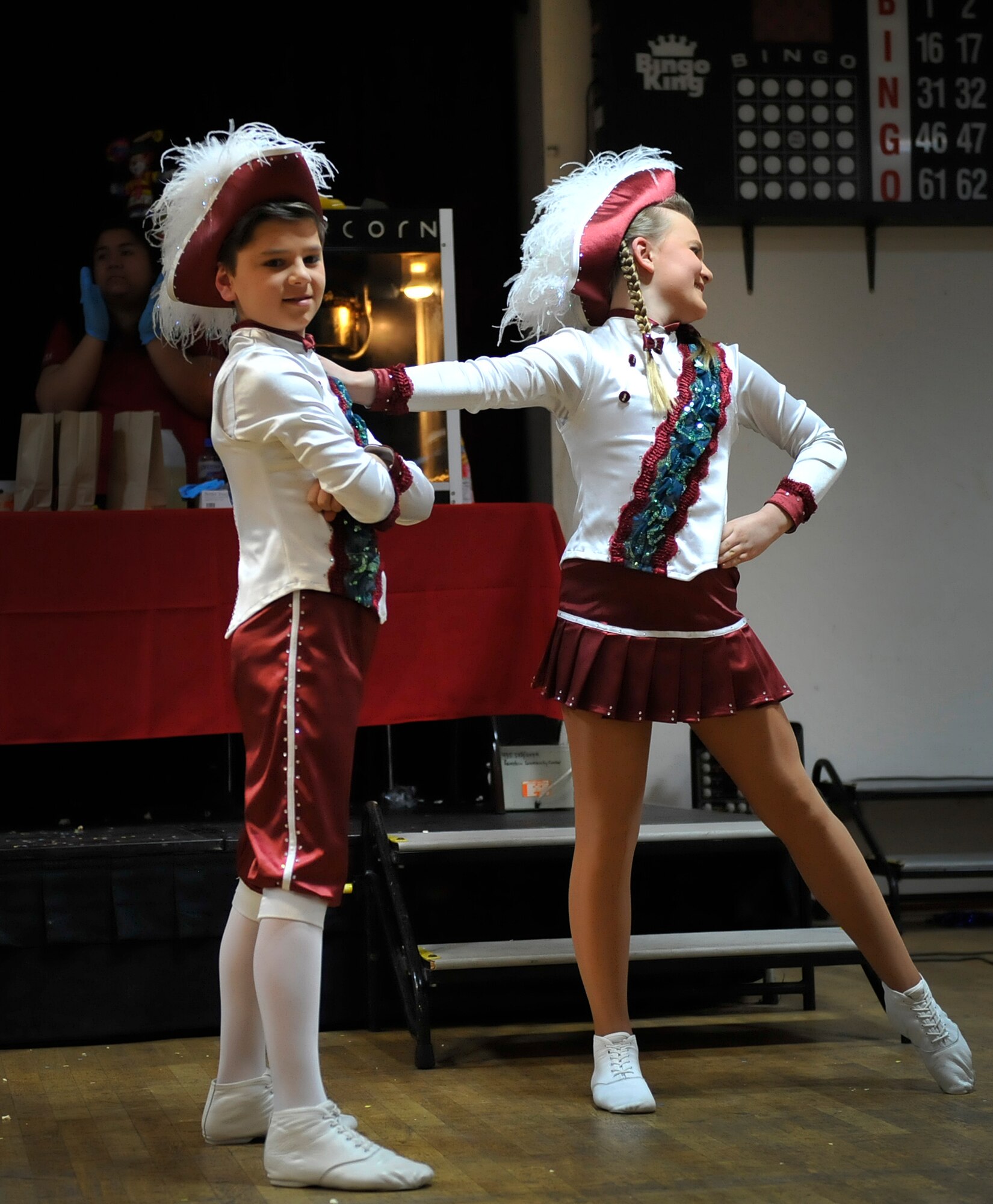 Mareike Schaumloeffel and Maris Schuler, a dance “tanzpaar,” or couple, perform a dance during a Kinder Fasching celebration Jan. 25, 2016, at Ramstein Air Base, Germany. The dance teams performed routines for a crowd to boost morale and excitement for upcoming Fasching parades. (U.S. Air Force photo/Airman 1st Class Larissa Greatwood) 