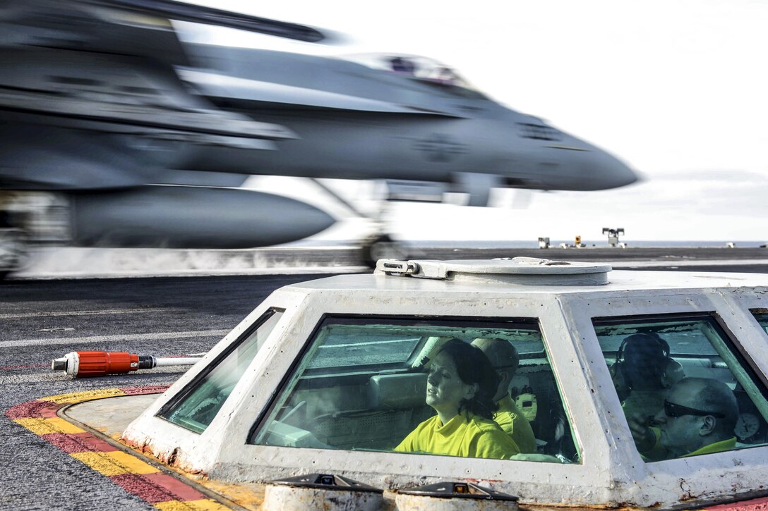 Navy Lt. Michelle Mayer launches an F/A-18C Hornet from the bubble on the flight deck of the USS John C. Stennis in the Pacific Ocean, Jan. 22, 2016. The Stennis is operating in the U.S. 3rd Fleet area of operations on a scheduled Western Pacific deployment. The Hornet is assigned to Strike Fighter Squadron 97. U.S. Navy photo by Petty Officer 3rd Class Kenneth Rodriguez Santiago