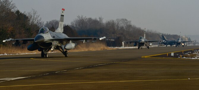 Pilots from the 36th Fighter Squadron taxi to the runway prior to takeoff during exercise Buddy Wing 16-1 at Seosan Air Base, South Korea, Jan. 27, 2016. The exercise provided an opportunity for the allied forces to train together and to learn how to communicate better in the event of real-world contingencies. (U.S. Air Force photo/Senior Airman Kristin High)