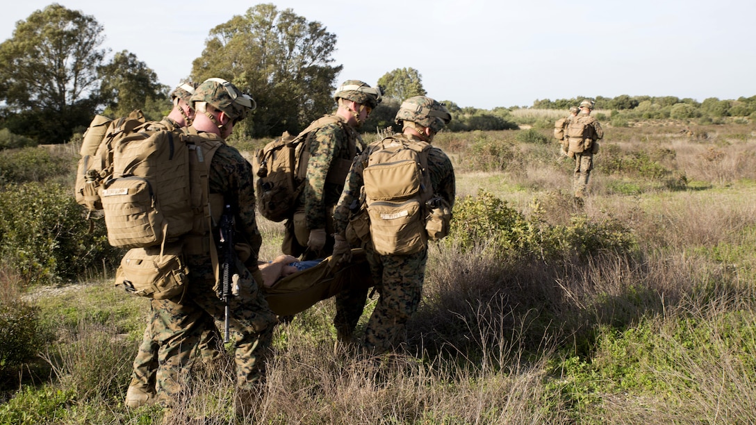 U.S. Marines with Special-Purpose Marine Air-Ground Task Force Crisis Response-Africa extract a simulated casualty during quick-response training at Naval Station Rota, Spain, January 23, 2016. The alert force tested the unit’s capabilities by simulating the procedures of reacting to a time-constrained, crisis-response mission.