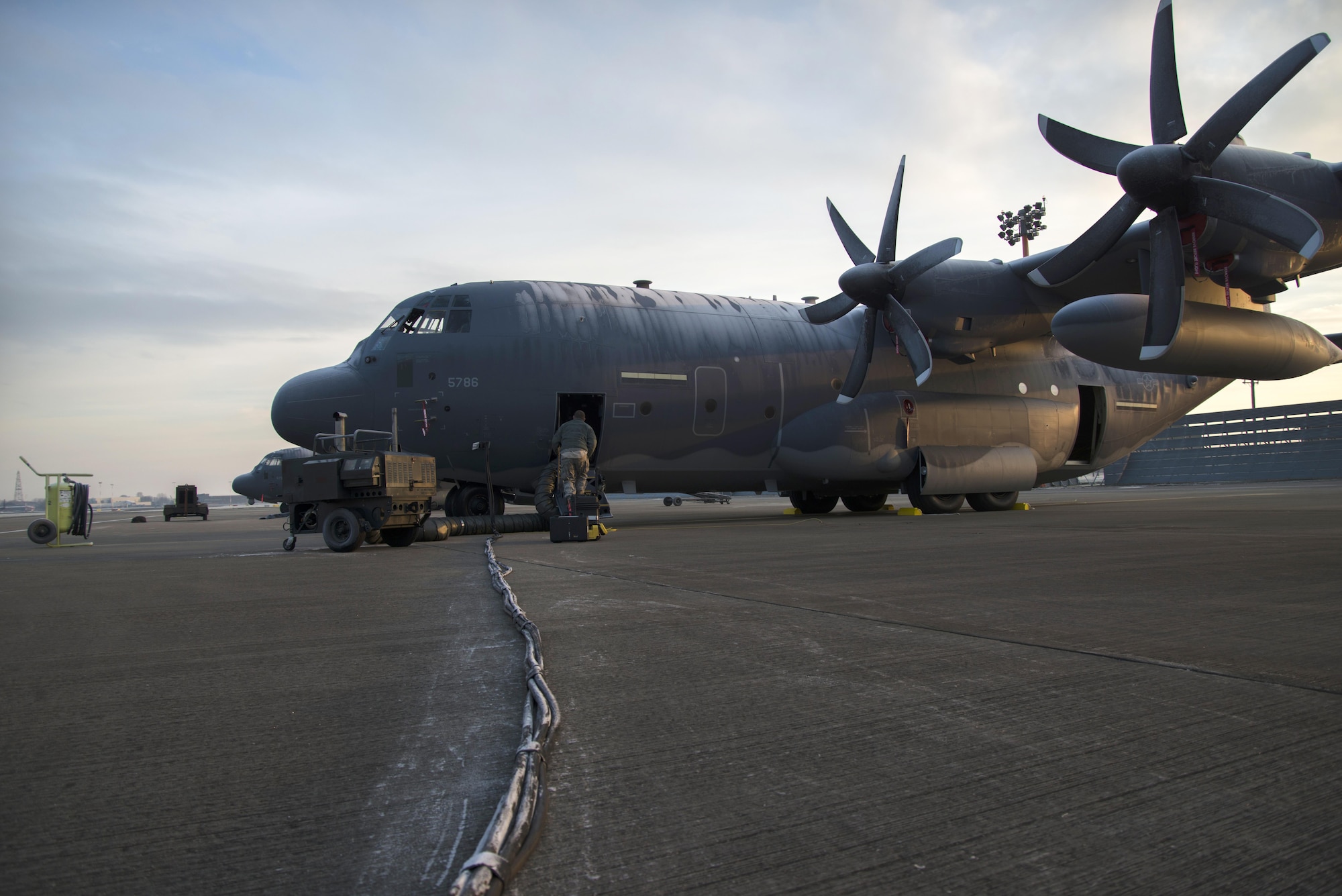 A maintainer from the 352d Special Operations Aircraft Maintenance Squadron boards a frost covered MC-130J Commando II, Jan. 21, 2016, while performing routine maintenance on RAF Mildenhall, England.  Maintenance crews work around the clock, regardless of the weather changes, to keep the MC-130J mission ready at a moment’s notice. (U.S. Air Force Photo by 1st Lt Chris Sullivan/Released