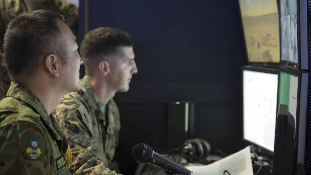 Marine Corps Staff Sgt. Michael Casey, battalion master gunner, 3rd Assault Amphibian Battalion and simulator operator, monitors a Japan Ground Self-Defense Force soldier’s performance alongside JGSDF Master Sgt. Fukase from the Western Army Infantry Regiment during Exercise Iron Fist 2016 at Marine Corps Base Camp Pendleton, California, Jan. 26. Iron Fist is an annual, bilateral amphibious training exercise that enables JGSDF soldiers and U.S. Marines to conduct combined amphibious operations. This year’s evolution will culminate with a scenario-based amphibious assault launching from the USS Somerset in late February.