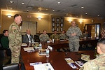 DLA Aviation at Richmond hosts a leadership professional development event for the 128th Aviation Brigade from Fort Eustis, Virginia Jan. 21, 2016.DLA Aviation Commander Allan Day, standing center, and 128th Aviation Brigade Commander Army Col. John Smith, standing left, facilitate discussions on demand chain processes in acquiring parts. 