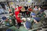 Members of the 920th Rescue Wing and the 249th Airlift Squadron conduct a pre-mission briefing aboard a C-17 Globemaster III aircraft at Patrick Air Force Base, Florida, Jan. 14, 2016, before departing for a simulated astronaut rescue mission. The 249th AS worked with NASA, the 920th Rescue Wing, the 45th Space Wing and Detachment 3 of the 45th Operations Group to develop tactics, training and procedures to quickly and safely recover astronauts in the event they would need to abort their spacecraft. 