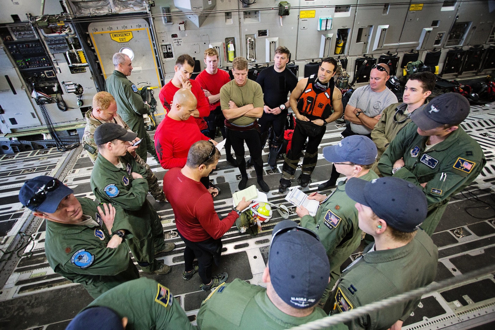 Members of the 920th Rescue Wing and the 249th Airlift Squadron conduct a pre-mission briefing aboard a C-17 Globemaster III aircraft at Patrick Air Force Base, Florida, Jan. 14, 2016, before departing for a simulated astronaut rescue mission. The 249th AS worked with NASA, the 920th Rescue Wing, the 45th Space Wing and Detachment 3 of the 45th Operations Group to develop tactics, training and procedures to quickly and safely recover astronauts in the event they would need to abort their spacecraft. 