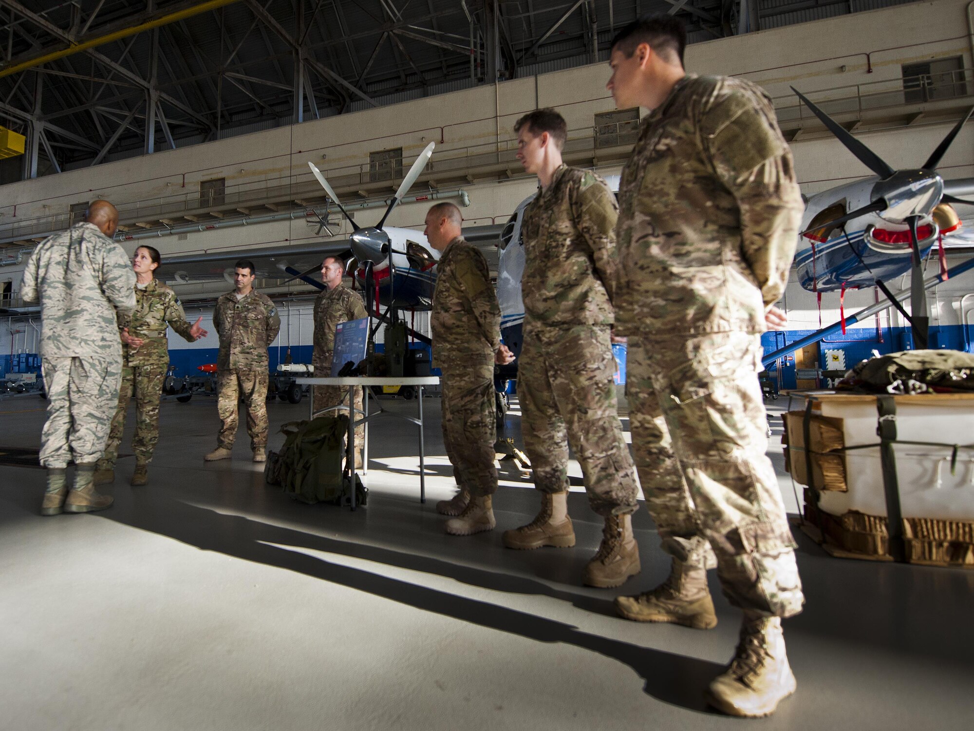 Lt. Col. Leslie Hadley, the 711th Special Operations Squadron commander, briefs a Commander-In-Chief’s Installation Excellence Award evaluator about the combat aviation advisor program and the Reserve mission of Duke Field during the team’s final stop at King Hangar Jan. 15 at Eglin Air Force Base, Fla.  Aircraft and displays from nearly every Team Eglin unit were represented in the hangar to provide a lasting impression of the base before the evaluators left to make their selections of this year’s winner.  (U.S. Air Force photo/Tech. Sgt. Sam King)