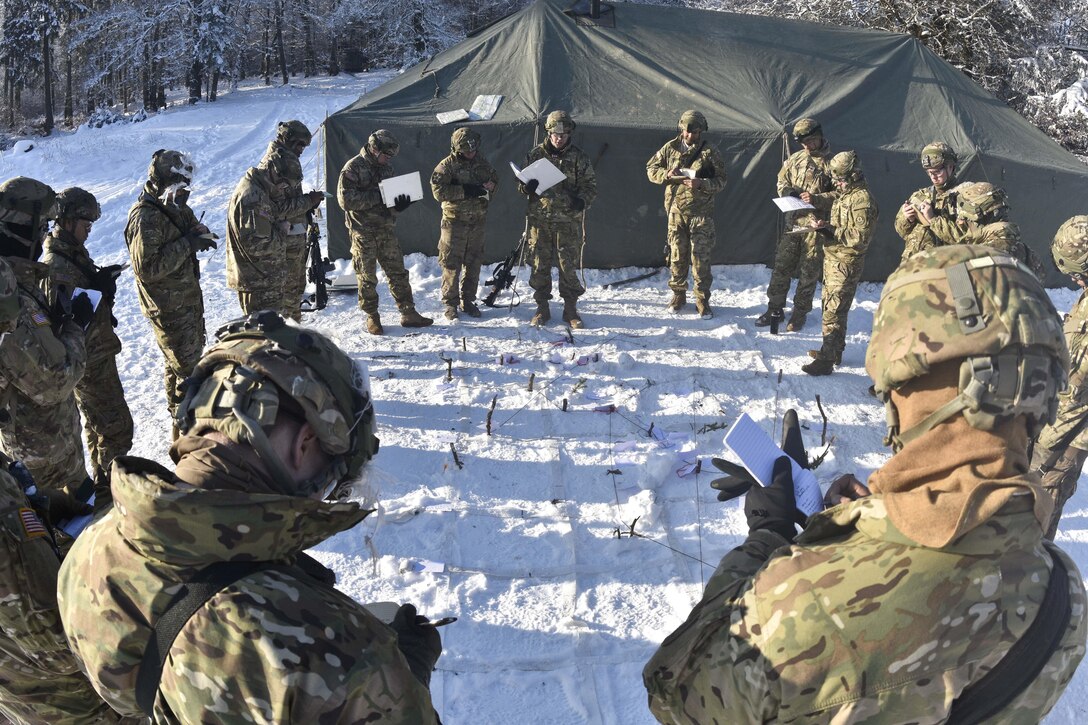 Soldiers receive a mission brief before conducting reconnaissance patrols and convoy maneuvers with their Stryker combat vehicles during a unit squad tactical exercise as part of Allied Spirit IV in Hohenfels, Germany, Jan. 20, 2016. The soldiers are assigned to the 2nd Squadron, 2nd Cavalry Regiment. Army photo by Sgt. William A. Tanner