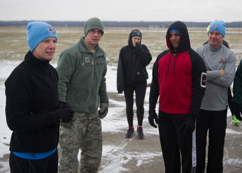 Col. Leah Lauderback (left), the National Air and Space Intelligence Center commander, thanks participants for coming out and supporting the unit’s 3rd annual NASIC Polar Bear Run Friday, Jan. 22, 2016 on the base’s flightline running trail. Eighty NASIC members participated in the event. The Center’s Enlisted Advisory Council sponsors the fundraiser run which uses the money for special events. (U.S. Air Force photo by Senior Airman Justyn Freeman) 