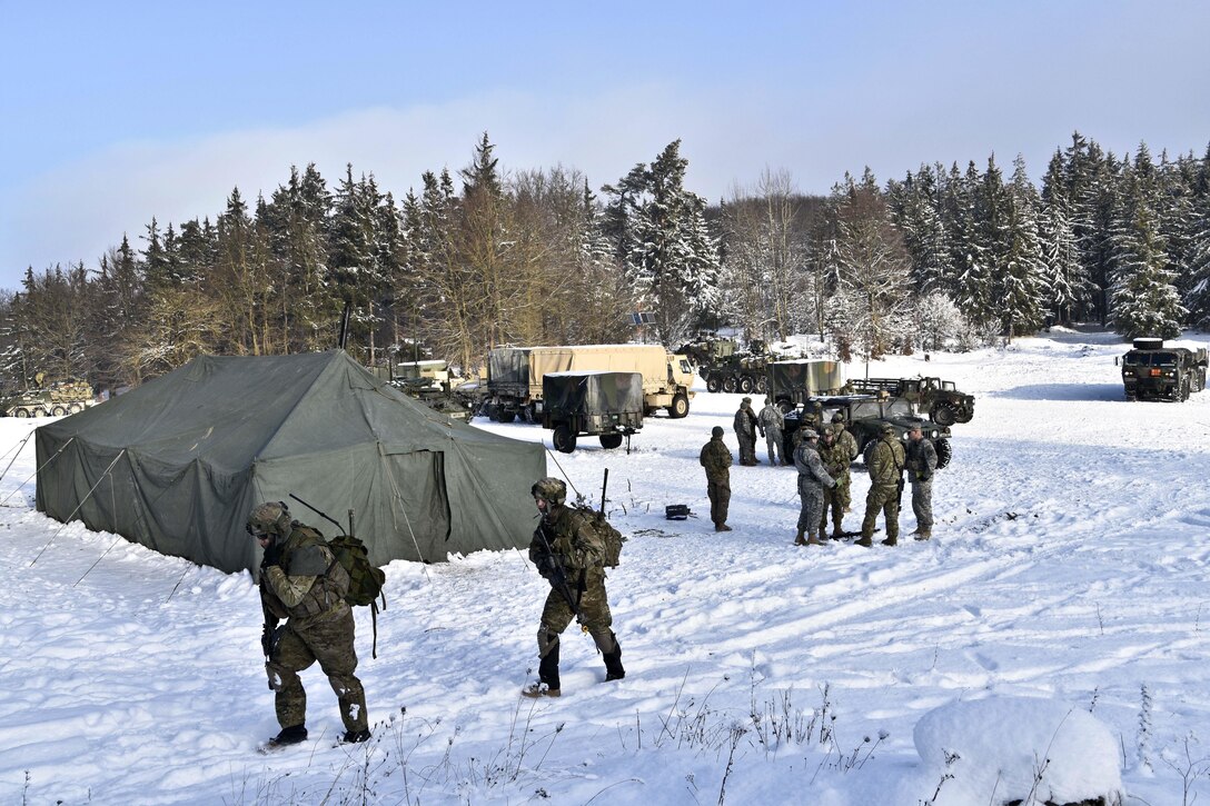 Soldiers move out to conduct reconnaissance patrols during a unit squad tactical exercise as part of Allied Spirit IV in Hohenfels, Germany, Jan. 20, 2016. Army photo by Sgt. William A. Tanner