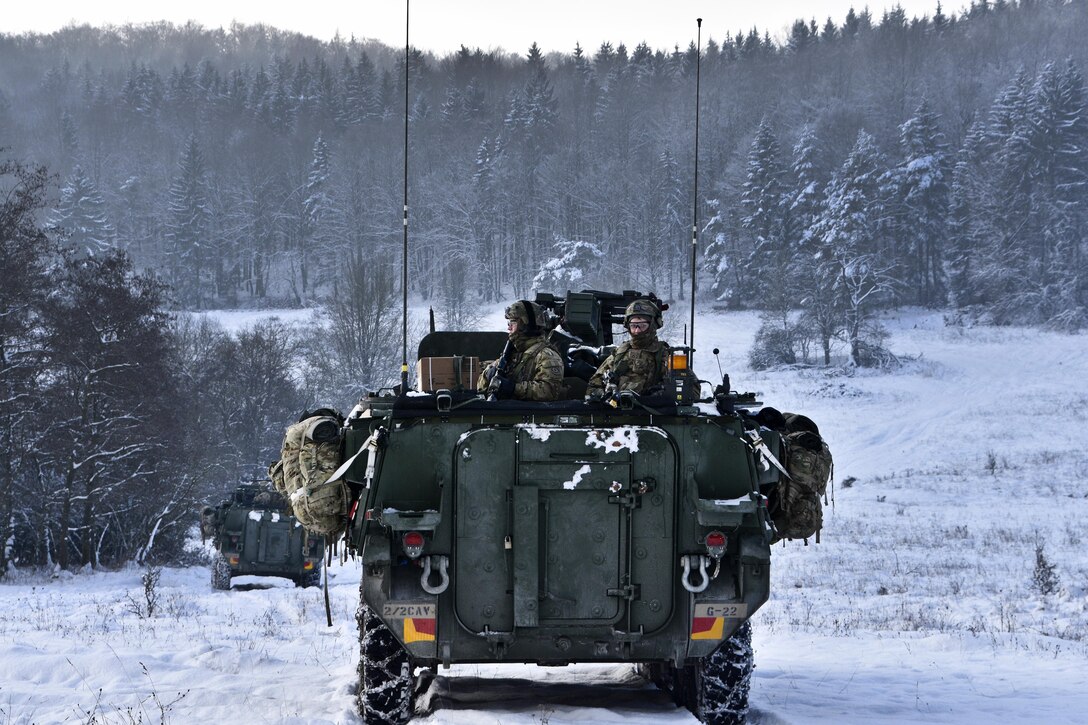 Soldiers provide security from the back of an armored vehicle conducting reconnaissance patrols and convoy maneuvers during a unit squad tactical exercise as part of Allied Spirit IV in Hohenfels, Germany, Jan. 20, 2016. Army photo by Sgt. William A. Tanner