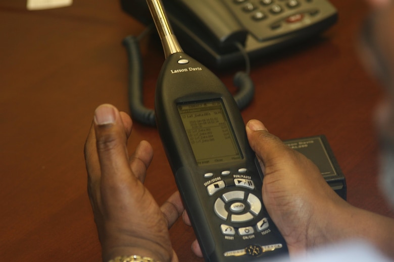 Bernard Truesdale, direct sales representative for Larson Davis, holds the Sound­Expert LxT, a sound level meter that he showed to the Hearing Conservation Task Force at a Jan. 12 meeting. The task force is looking to purchase a device to measure impulse noise from weapons firing.