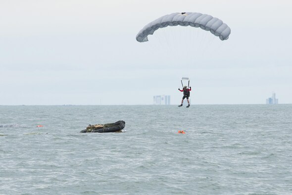 An Air Force Reserve pararescueman descends into the Atlantic Ocean from a C-17 Globemaster III in an effort to recover a NASA astronaut as part of an exercise Jan. 14, 2016, off the shore of Cape Canaveral Air Force Station, Fla. The 45th Operations Group’s Detachment 3 joined NASA's Commercial Crew Program; Air Force pararescuemen; combat rescue officers; and survival, evasion, resistance and escape specialists to practice recovering astronauts quickly and safely in the event they would need to abort their spacecraft. (U.S Air Force photo/Matthew Jurgens)