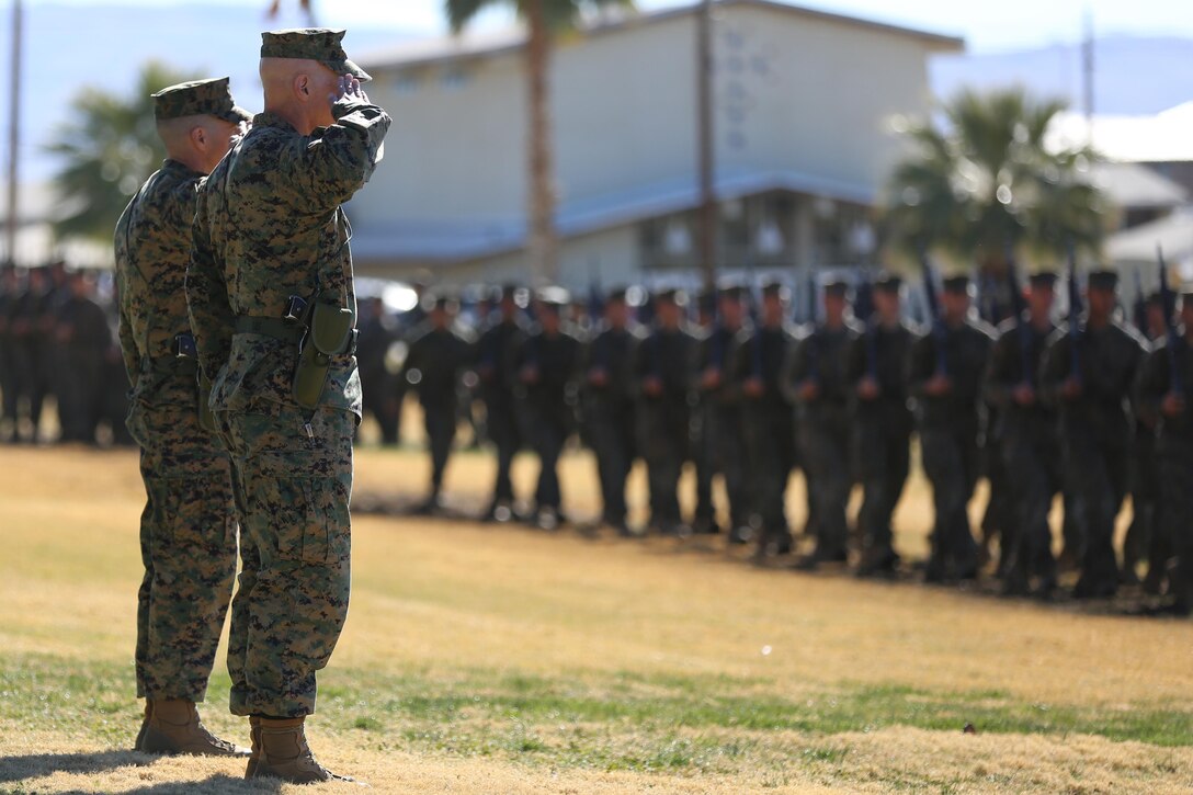 Col. Jay M. Bargeron, former commanding officer, 7th Marine Regiment and Col. William H. Vivian, commanding officer, 7th Marine Regiment, salute Marines and sailors performing a pass-in-review during the regiment’s change of command ceremony at Lance Cpl. Torrey L. Gray Field, Dec. 18, 2015. (Official Marine Corps photo by Cpl. Medina Ayala-Lo/Released)