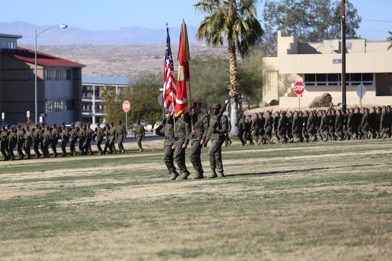 The 7th Marine Regiment Color Guard marches onto the field during the beginning of the 7th Marine Regiment change of command ceremony at Lance Cpl. Torrey L. Gray Field, Dec. 18, 2015. Bargeron took command of ‘Magnificent Seventh’ in 2013 and will move on to serve as the director of Tactical Training Exercise Control Group. (Official Marine Corps photo by Cpl. Medina Ayala-Lo/Released)