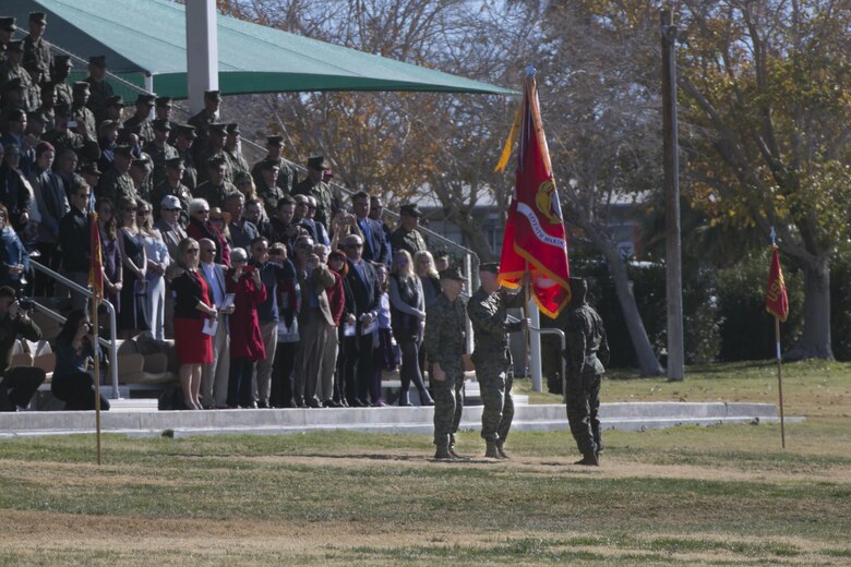 Col. William H. Vivian, commanding officer, 7th Marine Regiment, holds the Regimental Colors after receiving them from Col. Jay M. Bargeron, former commanding officer, 7th Marine Regiment, during the regiment’s change of command ceremony at Lance Cpl. Torrey L. Gray Field, Dec. 18, 2015. (Official Marine Corps photo by lance Cpl. Thomas Mudd/Released)