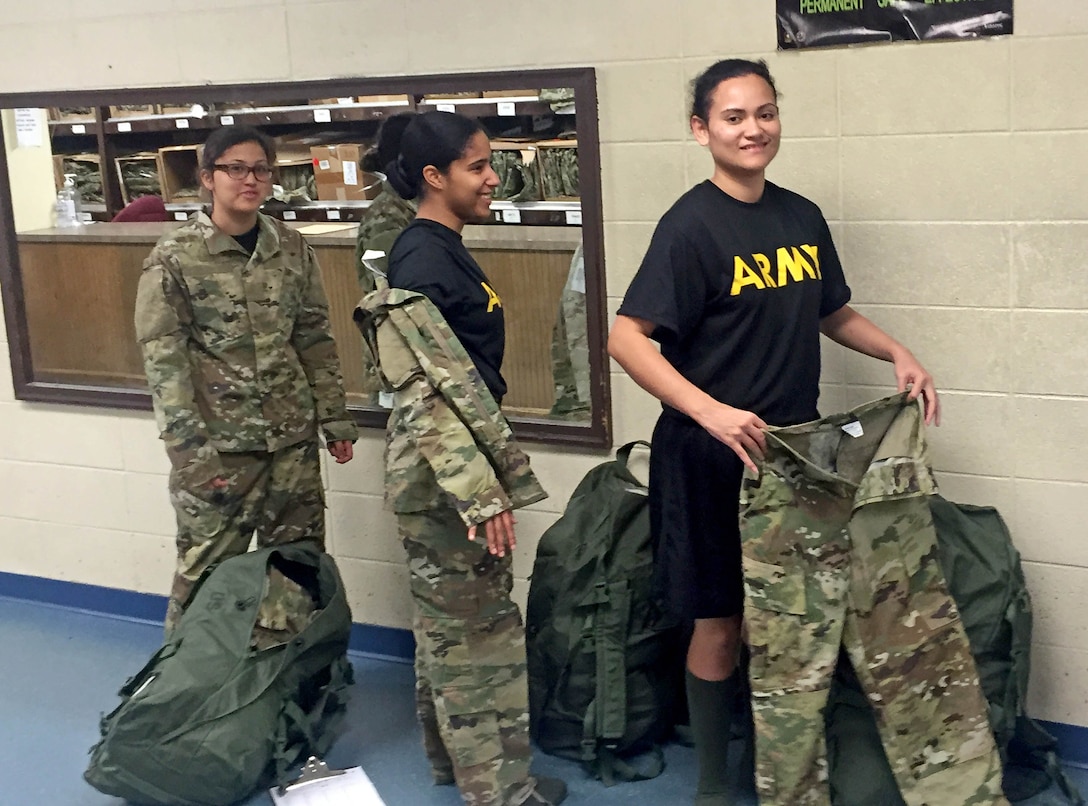 New Army recruits receive updated operational camouflage pattern Army combat uniforms and accessories at Fort Benning, Georgia, Dec. 20. Approximately 1,300 recruits at Fort Benning have already been issued the fiscal year 2016 clothing bag, which includes OCP ACUs and accessories.