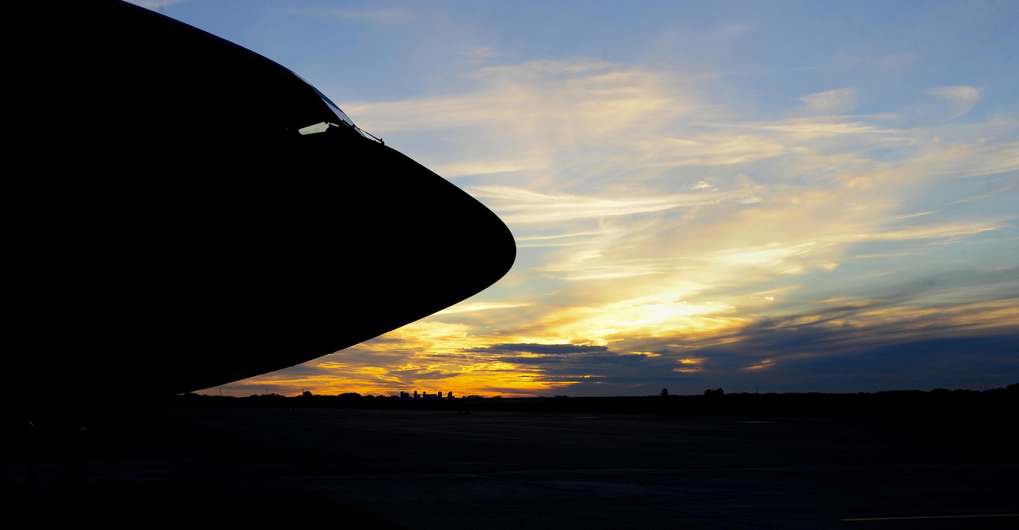 A KC-135 Stratotanker sits on the flightline at MacDill Air Force Base, Fla., as the sun sets over St. Petersburg, Fla., Jan. 12, 2016. The 16 KC-135s currently assigned to MacDill AFB provide aerial refueling to nine combatant commands. (U.S. Air force photo/Airman 1st Class Mariette M. Adams)