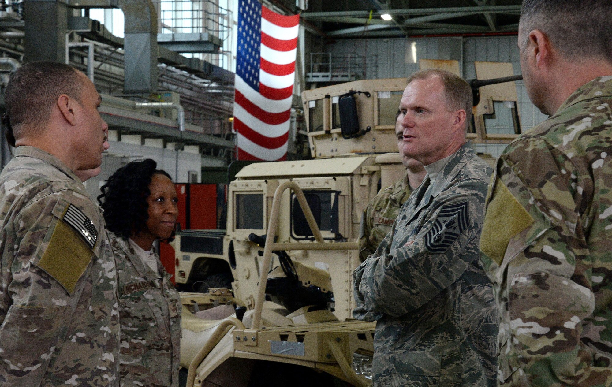Chief Master Sgt. of the Air Force James Cody speaks with Airmen from the 352nd Special Operations Wing Jan. 27, 2016, on RAF Mildenhall, England. During his visit, Cody met with Airmen from various units to learn about their duties and express his gratitude for their hard work and dedication to the mission. (U.S. Air Force photo by Airman 1st Class Justine Rho/Released)
