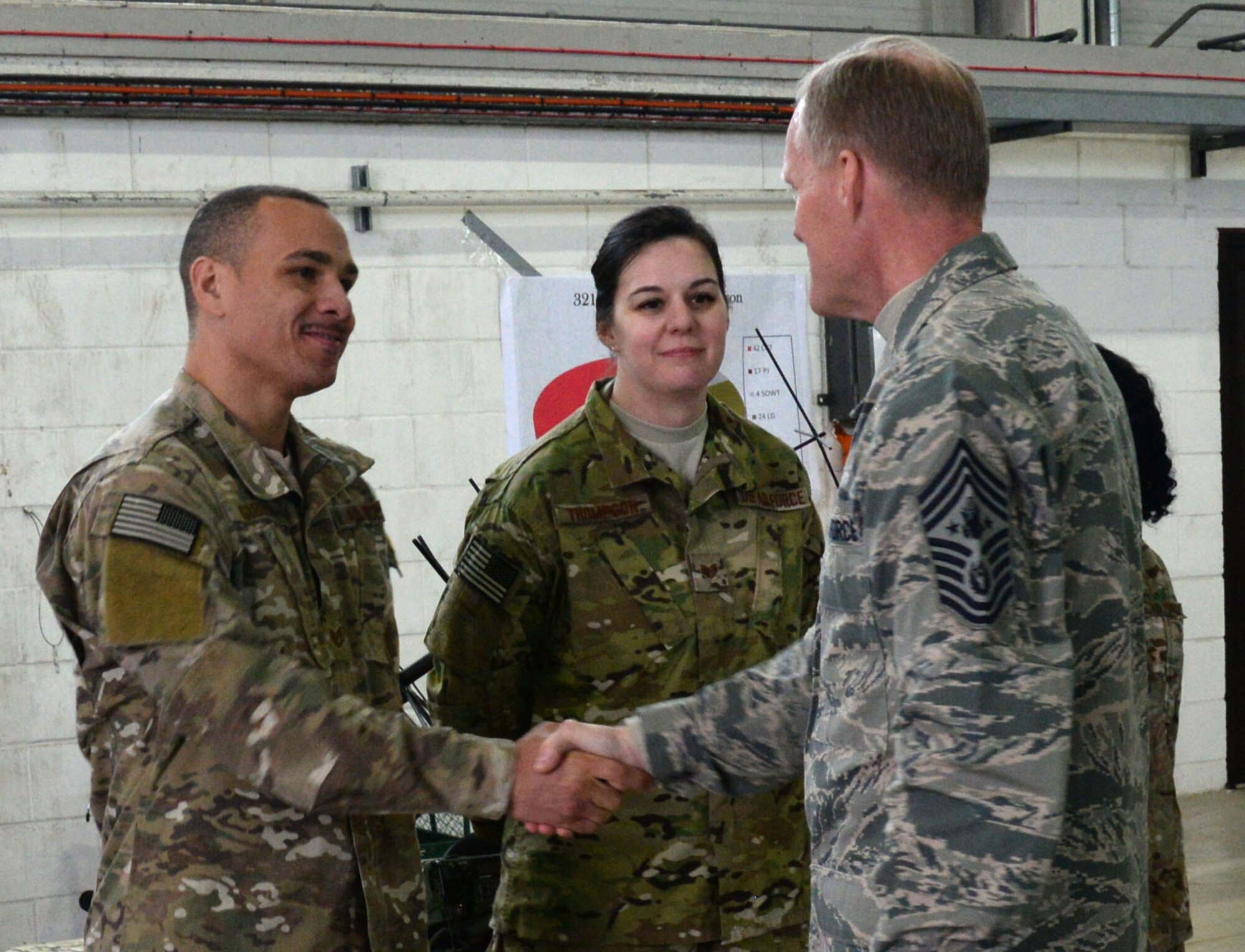 Chief Master Sgt. of the Air Force James Cody dedicates time to socialize with Airmen during his visit Jan. 27, 2016, on RAF Mildenhall, England. He visited various units to learn about the duties of Airmen around the base and express his gratitude for their hard work and dedication to the mission. (U.S. Air Force photo by Airman 1st Class Justine Rho/Released)
