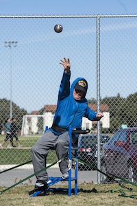 Retired Senior Master Sgt. Jessey Baca throws a shot put Jan. 22, 2016, during the South Central Regional Warrior Caregiver, Adaptive and Rehabilitative Sports, Recovering Airmen Mentorship Program, and Employment and Career Services Event. Warriors engage in adaptive and rehabilitative sports, discover ways to achieve employment and career readiness goals, and receive training on how to become mentors.