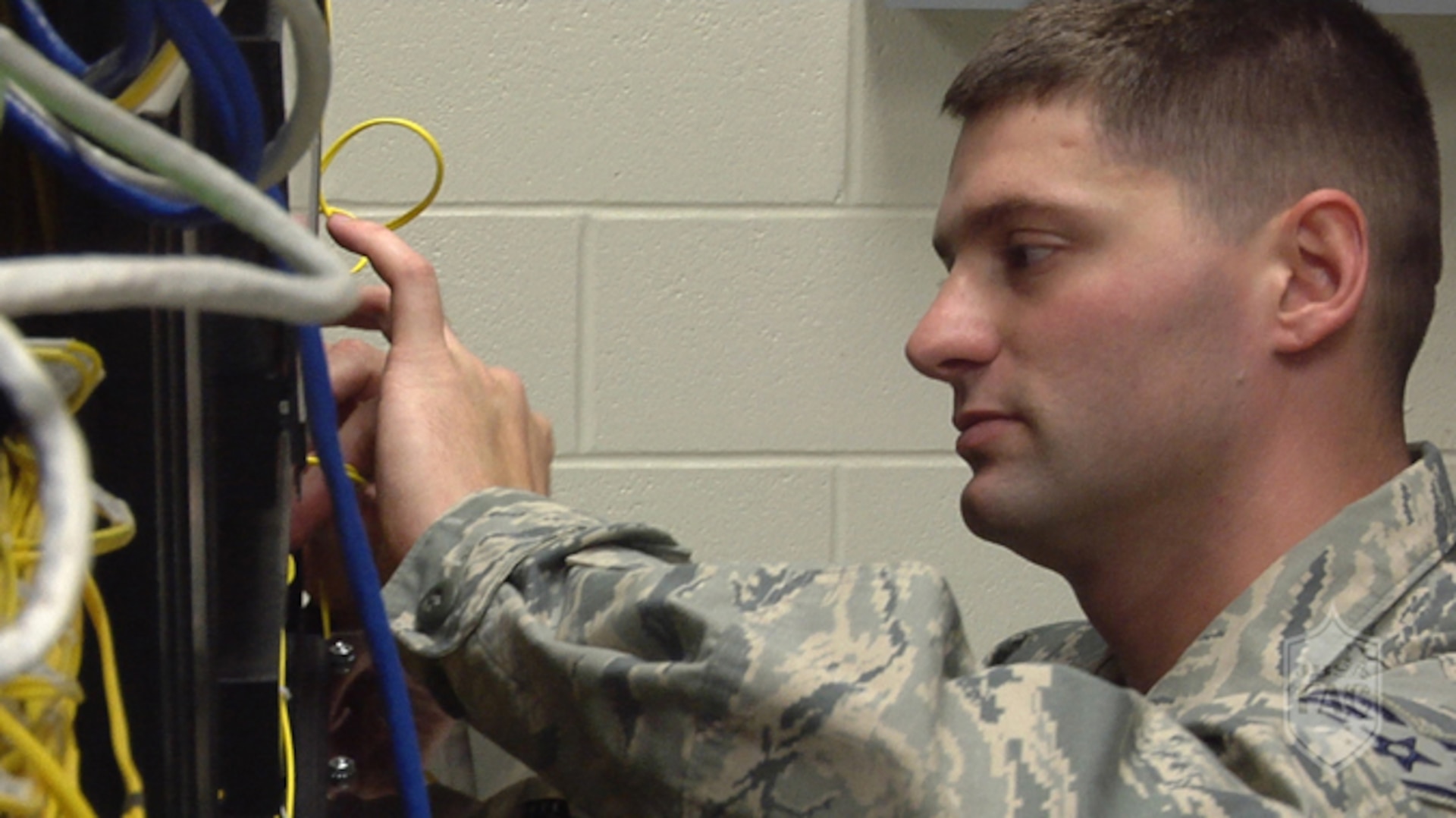 Staff Sgt. Adam Nichols, 502nd Communications Squadron cable and antenna systems craftsman, connects network cables Sept. 14, 2015, at Joint Base San Antonio-Fort Sam Houston. Members of the 502nd CS install telephones, local area network connections, install and maintain antennas, and maintain communications towers.