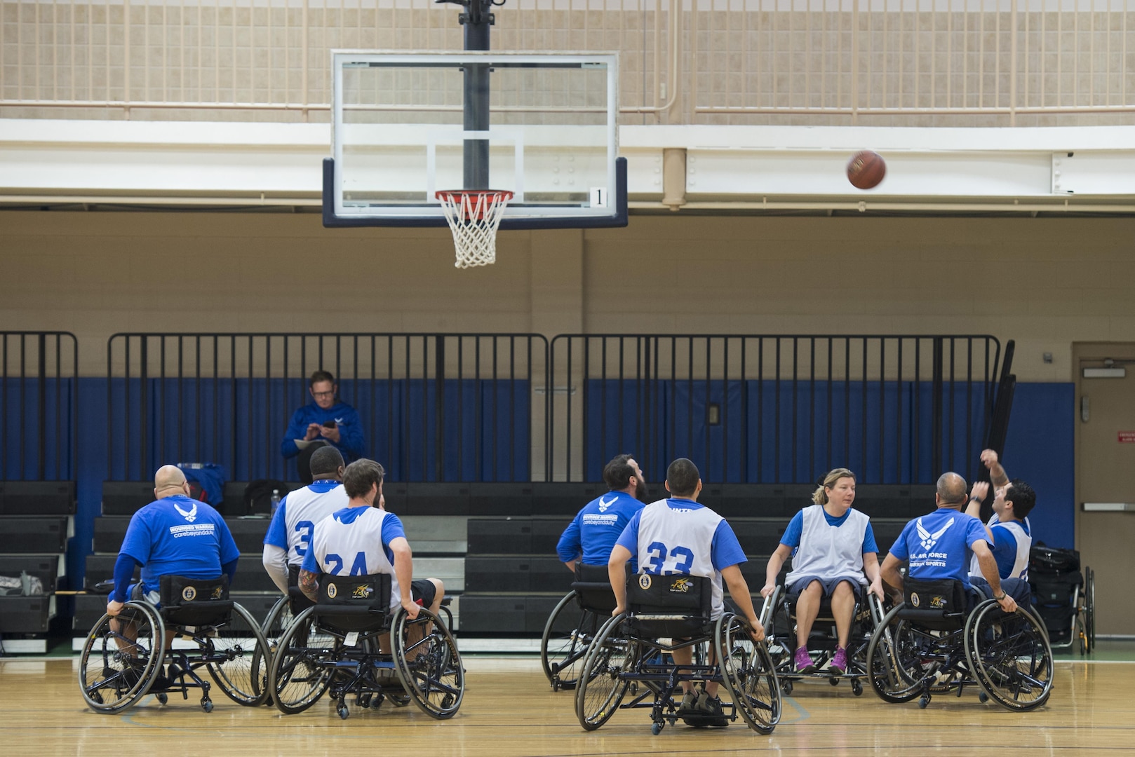 Wounded Warriors play wheelchair basketball Jan. 22, 2016, during the South Central Regional Warrior Caregiver, Adaptive and Rehabilitative Sports, Recovering Airmen Mentorship Program, and Employment and Career Services Event. Warriors engage in adaptive and rehabilitative sports, discover ways to achieve employment and career readiness goals, and receive training on how to become mentors.