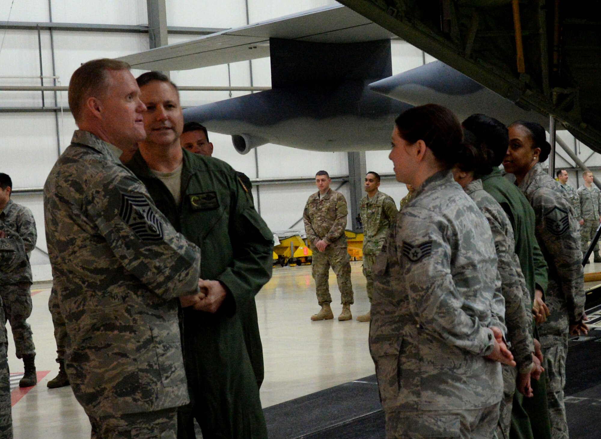 Chief Master Sgt. of the Air Force James Cody dedicates time to socialize with Airmen during his visit Jan. 27, 2016, on RAF Mildenhall, England. He visited various units to learn about the duties of Airmen around the base and express his gratitude for their hard work and dedication to the mission. (U.S. Air Force photo by Airman 1st Class Justine Rho/Released)