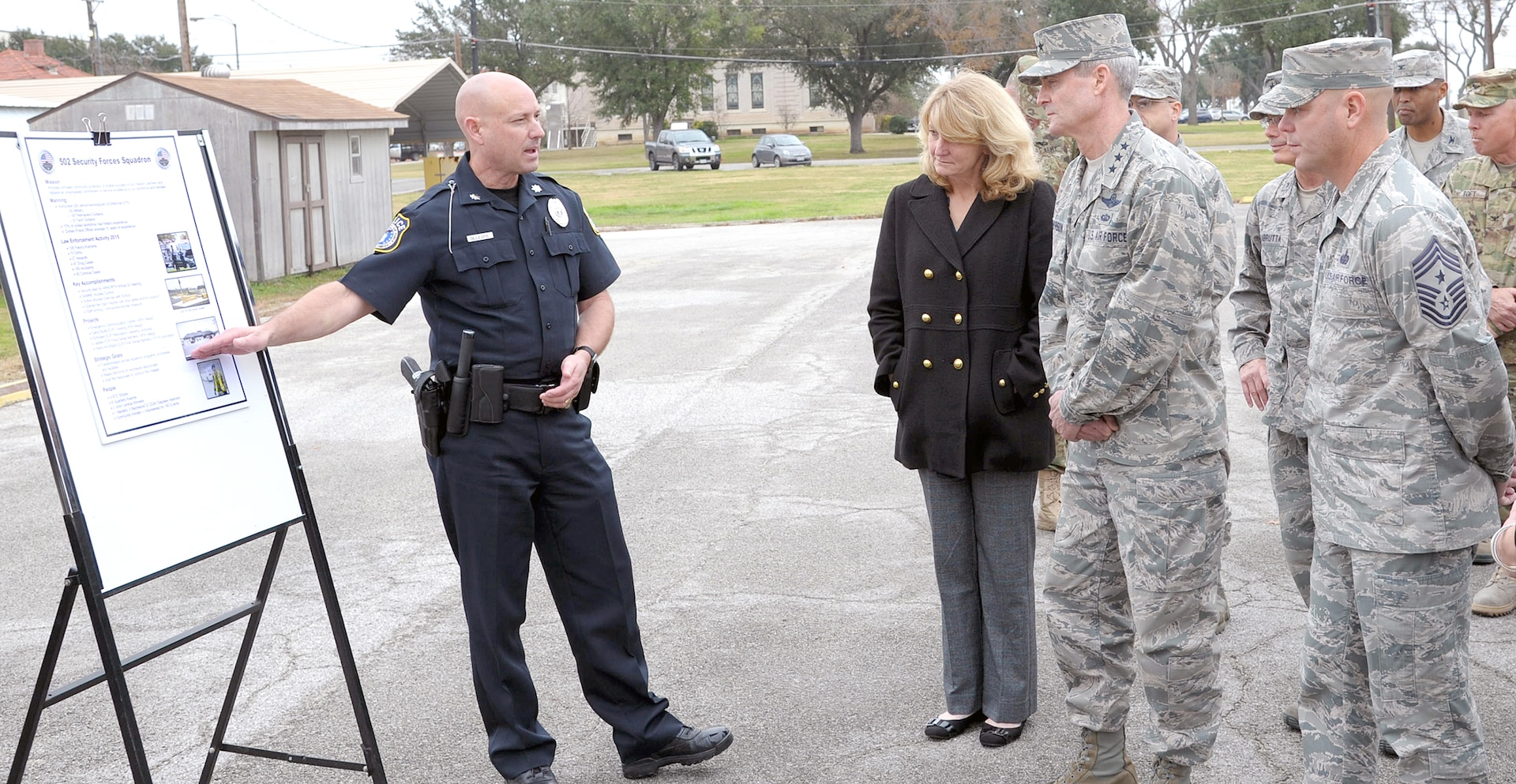 Bryan Gillespie (left), 502nd Security Forces Squadron director, briefs Lt. Gen. Darryl Roberson, commander of Air Education and Training Command, his wife, Cheryl; and Chief Master Sergeant David R. Staton, AETC command chief master sergeant, on the 502nd SFS mission Jan. 20 at Joint Base San Antonio-Fort Sam Houston’s Base Defense Operations Center.